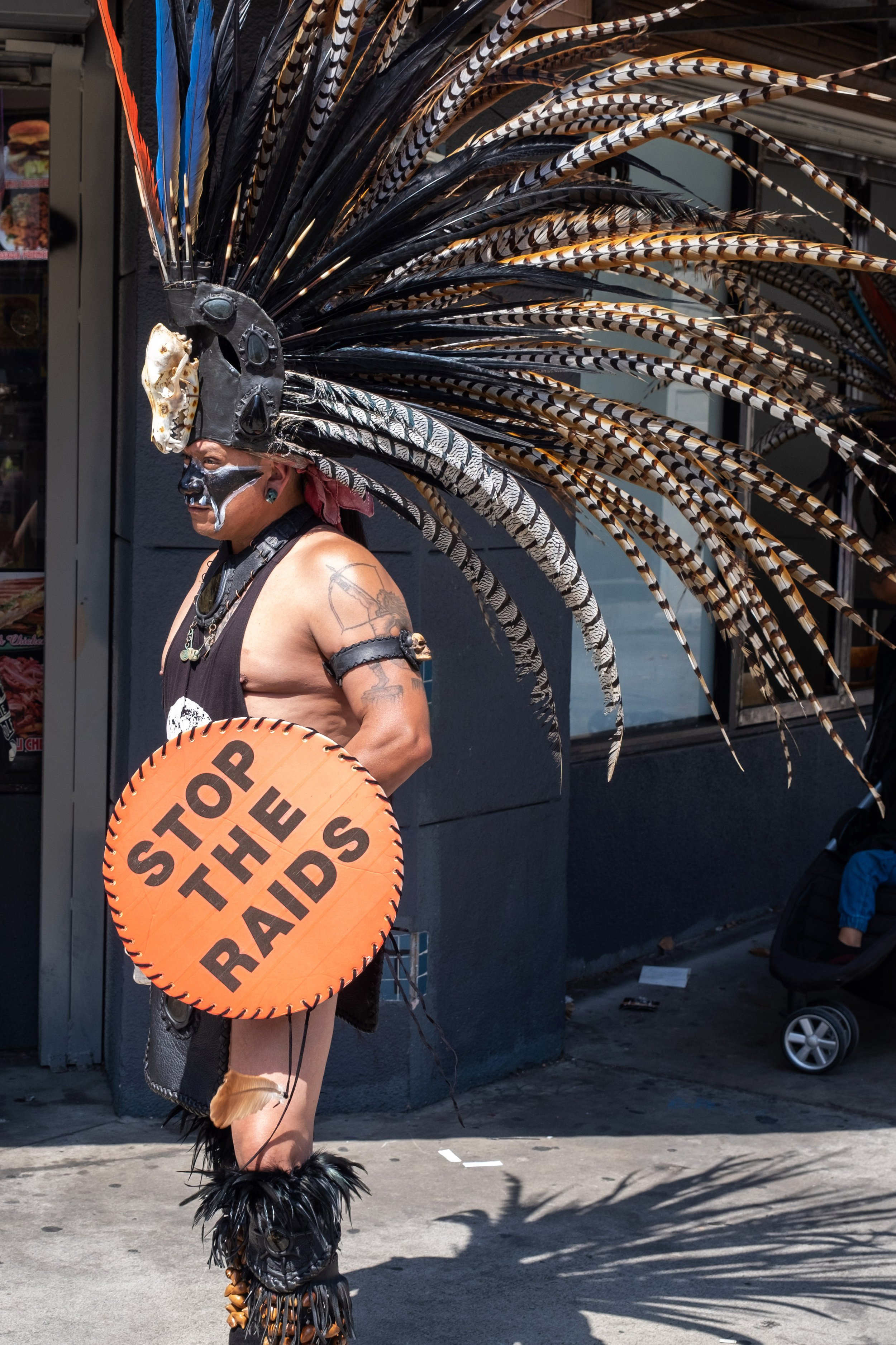  Tleyotl is an Aztec dancer from Mexico, who normally performs in Torrance, but showed up to support street vendor workers at the May Day March. Broadway & Olympic Blvd in Los Angeles, on Sunday, May 1, 2022. (Anna Sophia Moltke | The Corsair) 