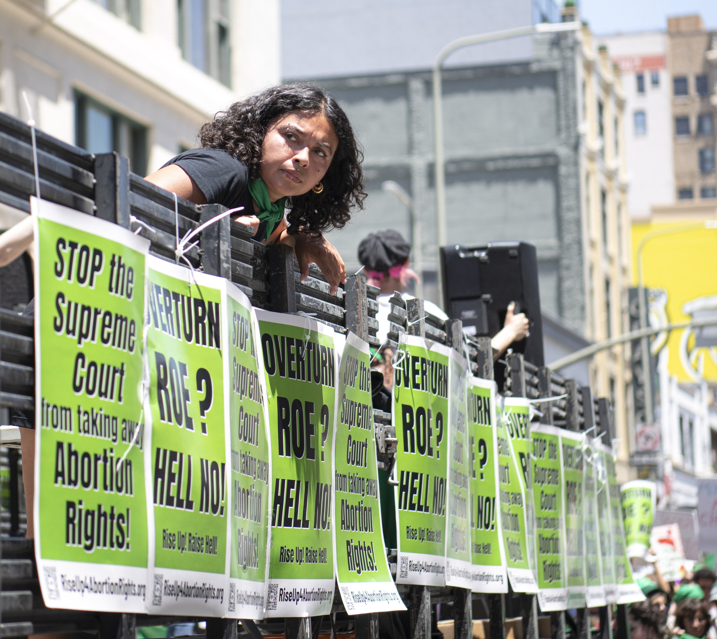  A Rise4AbortionRights leader looks at the oncoming police officers as they march through the streets of DTLA on May 14, 2022 in Los Angeles, CA. (Jon Putman | The Corsair) 