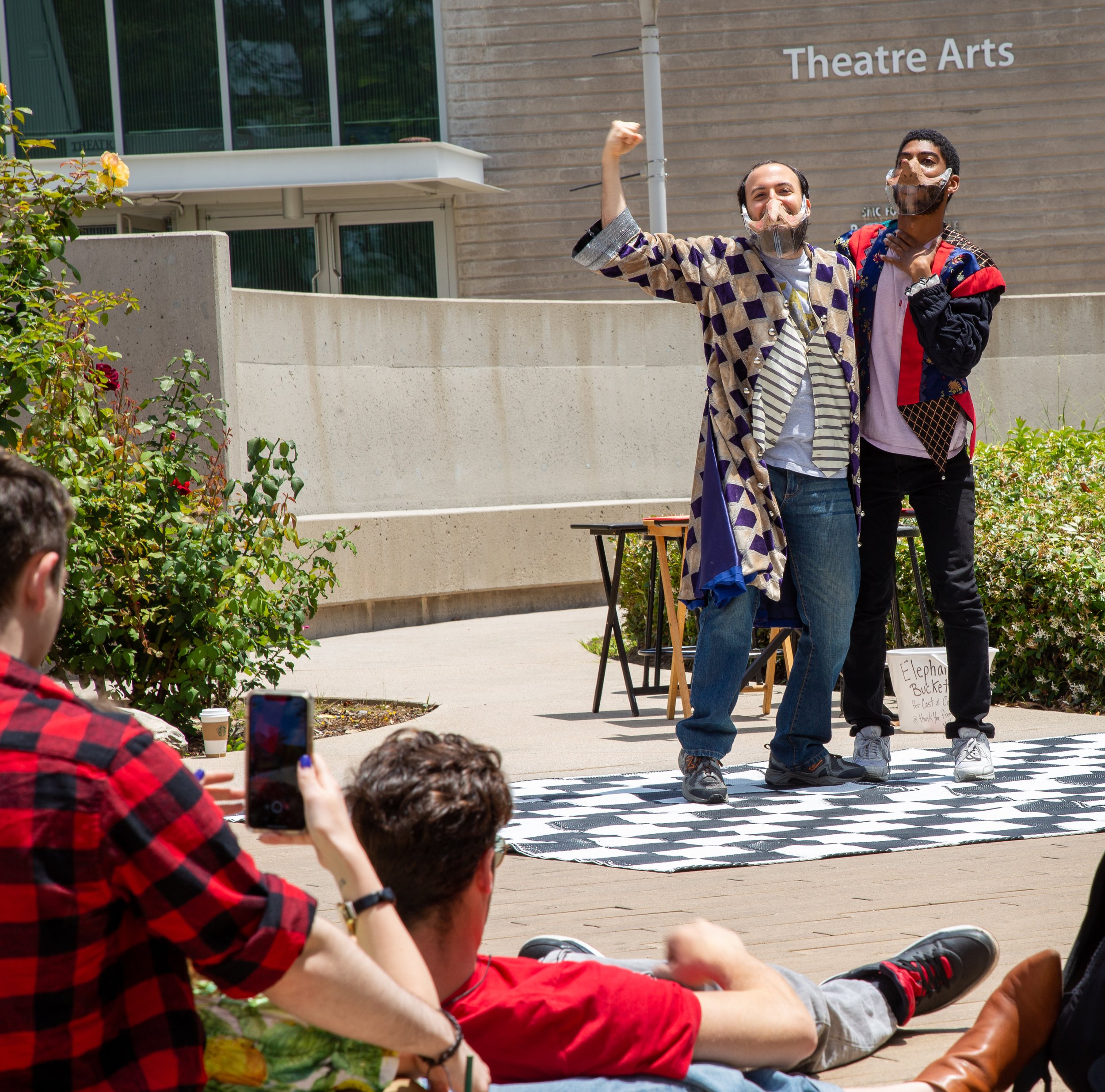  Devion Crawford (L), and Allen Tehrani (R), act as the audience watches on.  This performance is a pop up performance that will serve as their mid term for the comedy class (TH ART 46) in the main quad at Santa Monica College in Santa Monica, Califo