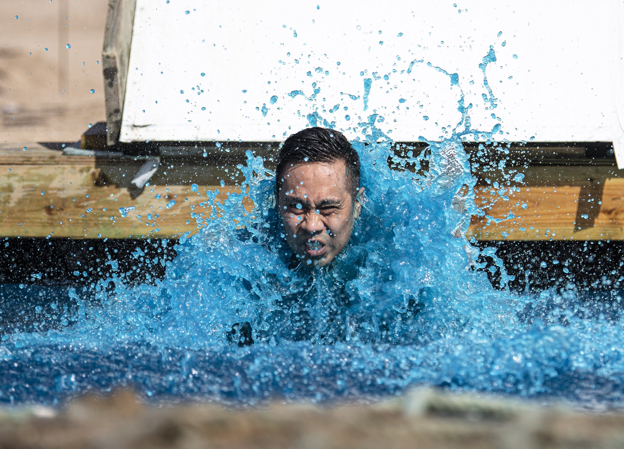  A Tough Mudder Competitor breaks the surface of the water at the Ice Bath obstacle at the Tough Mudder event held in San Bernadino on April 9, 2022. (Jon Putman | The Corsair) 