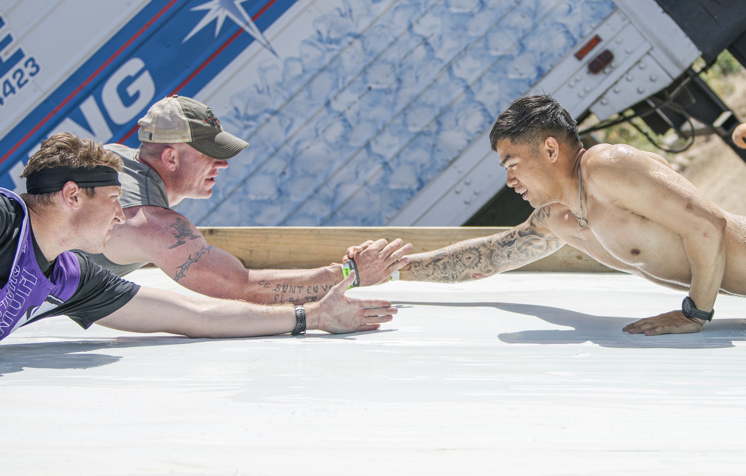  Marines from the nearby Camp Pendleton held each other over the slanted oiled wall at the final portion of the Tough Mudder event held in San Bernadino, Calif. on April 9, 2022. (Jon Putman | The Corsair) 