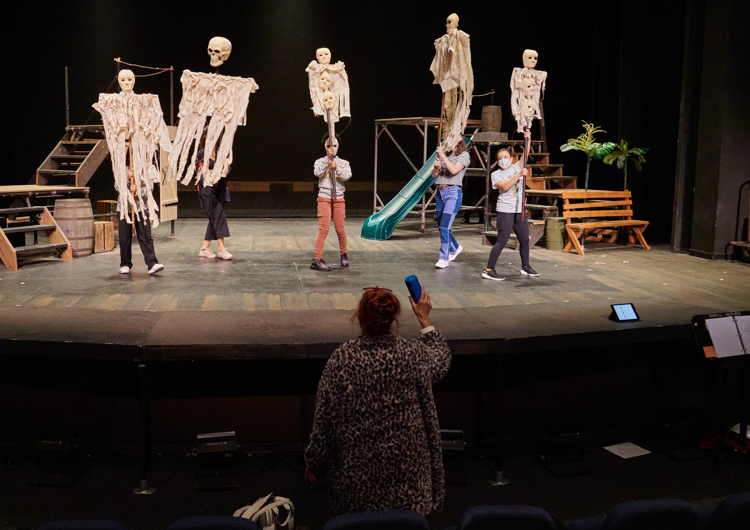  Director Terrin Adair holds up a speaker to rehearse one of the musical interludes of the Santa Monica College Theatre Arts production of "Treasure Island" at the SMC Main Stage on Wednesday, April 27, 2022, in Santa Monica, Calif. (Nicholas McCall 