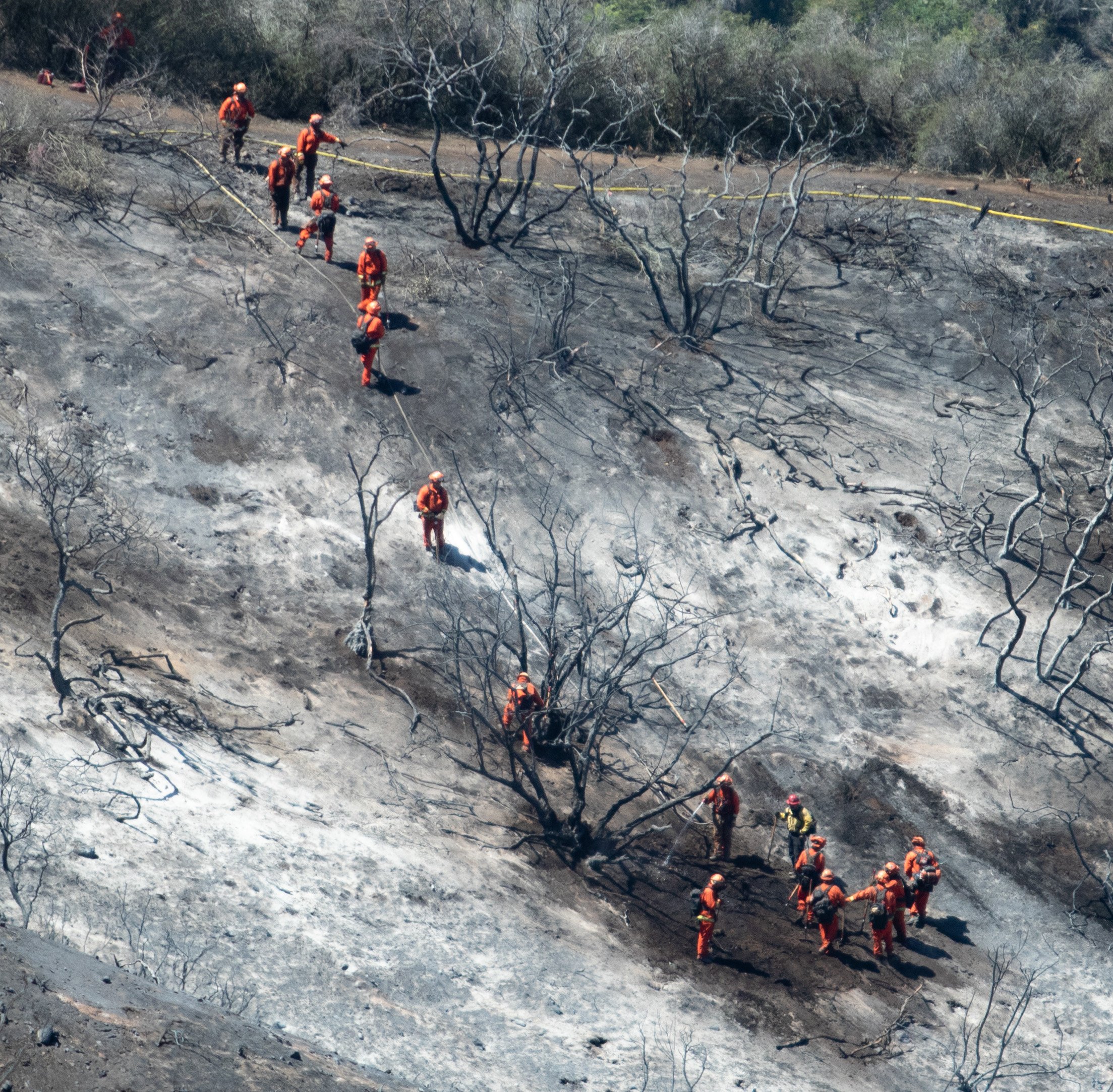  Incarcerated Firefighters mitigating hotspots in the hills on Fri. May 13, 2022 at Laguna Niguel, Calif. (Danilo Perez | The Corsair) 