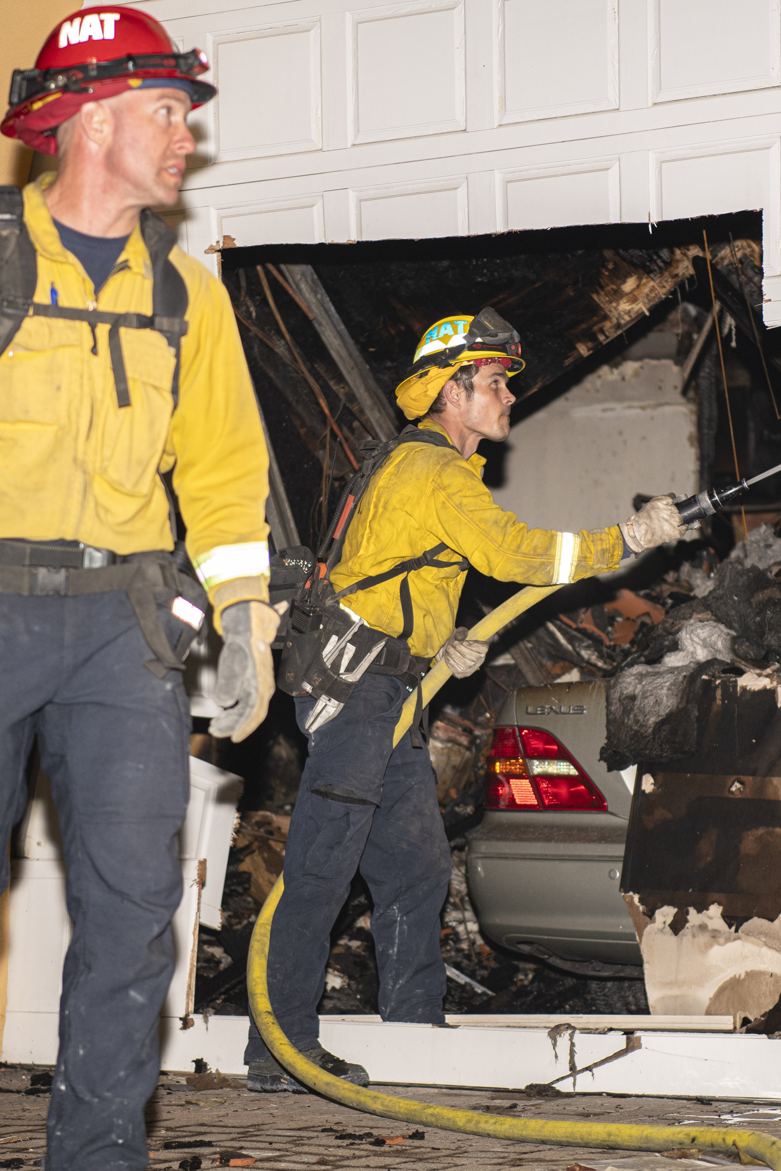  San Diego firefighters spray down a multi-million dollar house after a small brush fire that occured on Wedneday, May 11th, turned into a firey blaze that took over 200+ acres and 23 Confirmed homes. According to San Diego Firefighters on scene, the