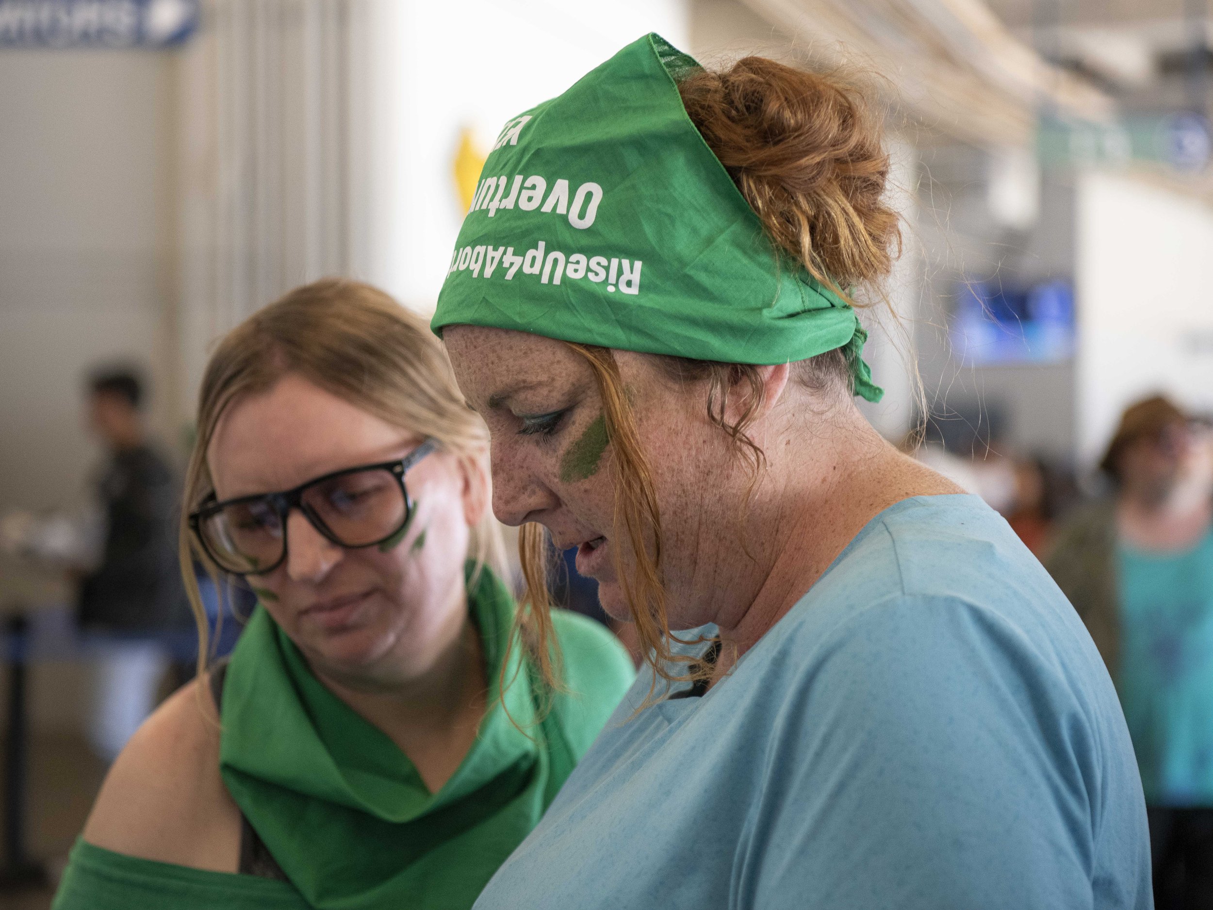  Rise Up for Abortion Rights member plan their strategy after getting through securty before their planned 4th inning execution during the 1:00 p.m game vs. the New York Mets at Dodger Stadium Sunday, June 5. (Jon Putman | The Corsair) 