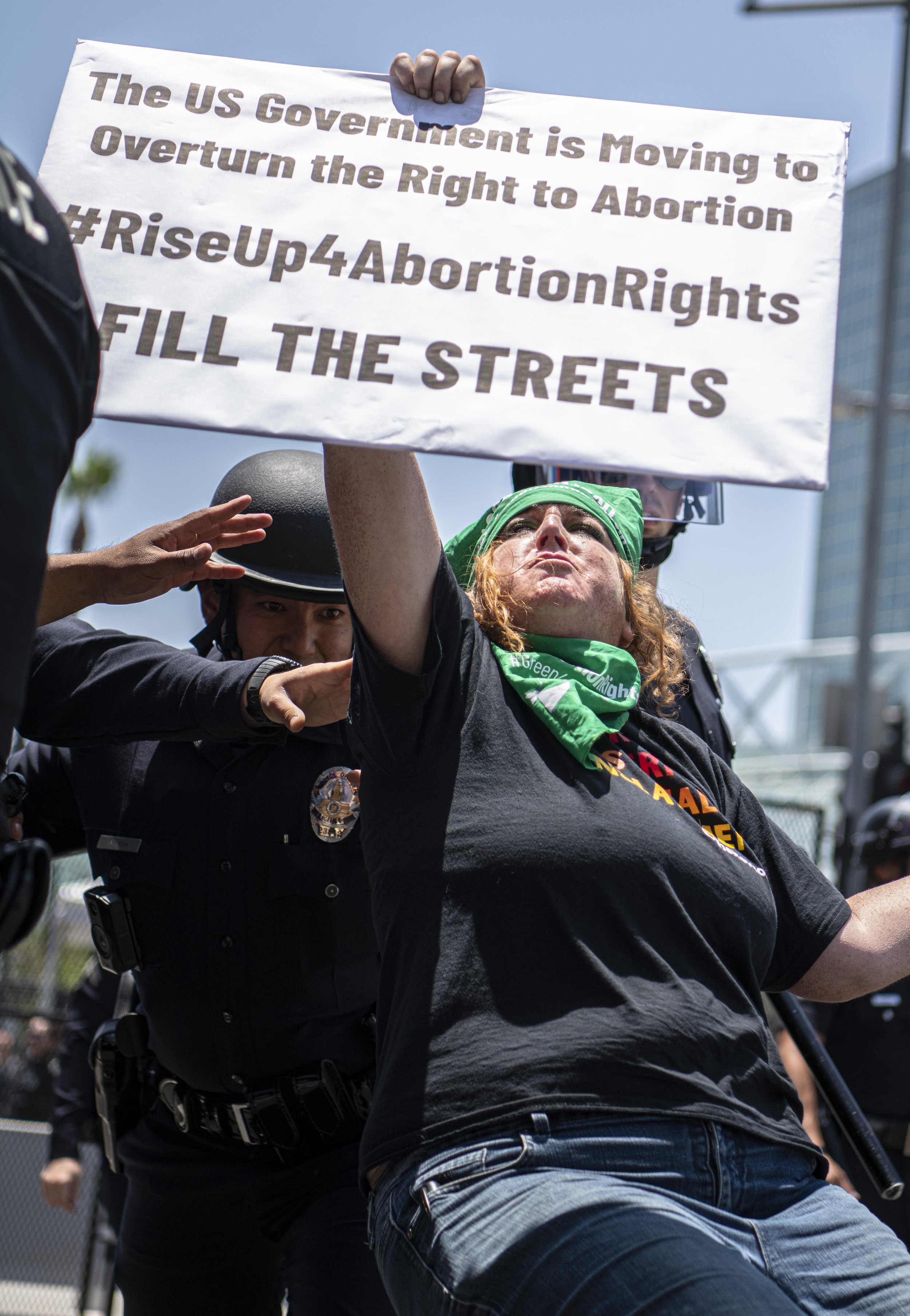  An abortion rights protestor get shoved away from the entrance of the Convention Center where the 9th Annual Summit of Americas is being held. (Jon Putman | The Corsair) 