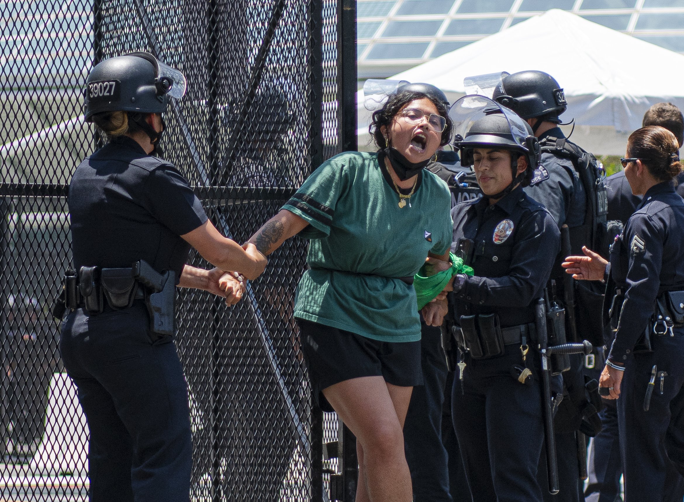  An Abortion rights protestor chains herself to the entrance gates of the Convention Center where the 9th annual summit is being held. (Jon Putman | The Corsair) 