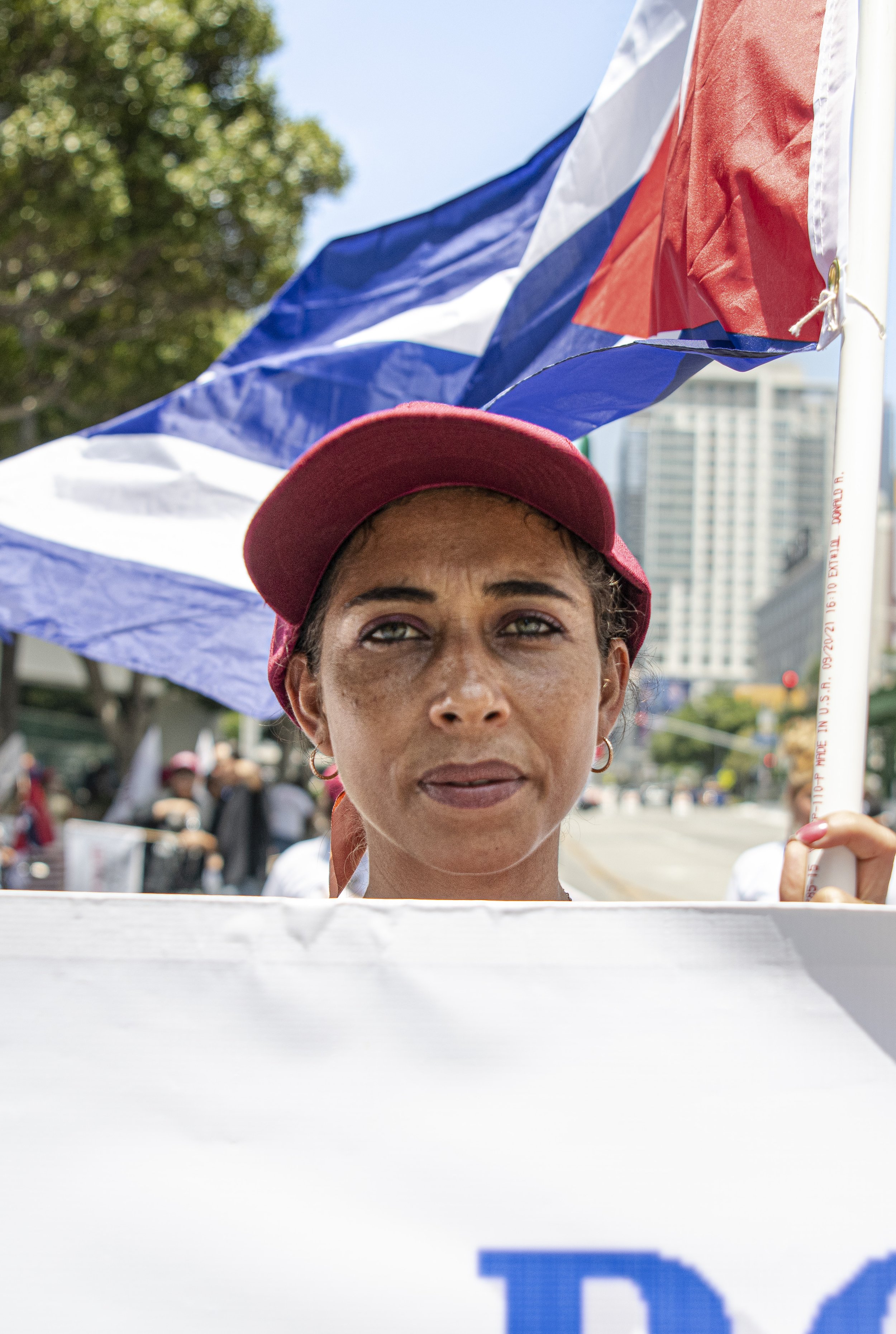  A protestor for the Latin America protest marchs towards the front gates of the Convention Center in downtown Los Angeles. (Jon Putman | The Corsair) 