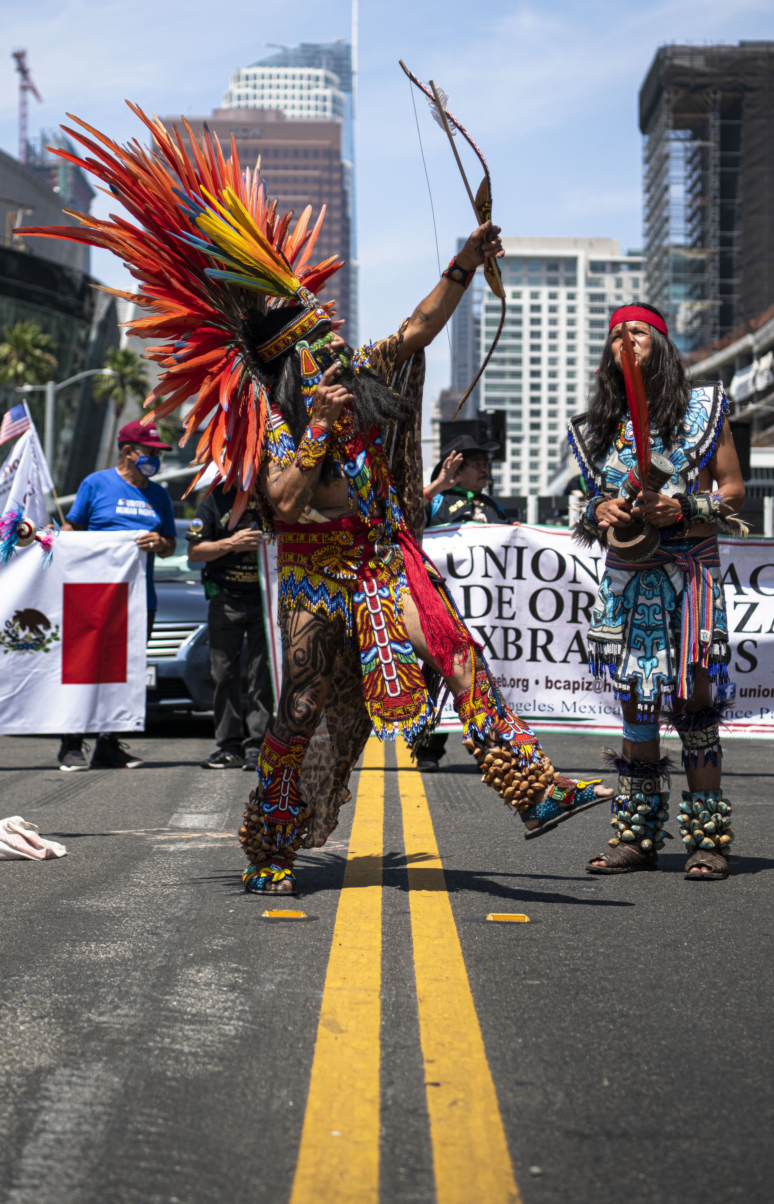  A protestor for the Latin America group performs a Latin  ritual for the crowds at the front gates of the Convention Center in downtown Los Angeles. (Jon Putman | The Corsair) 