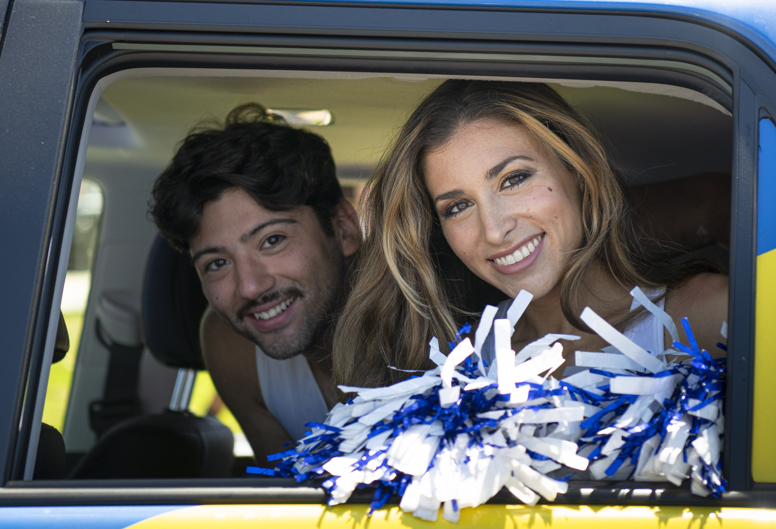  Los Angeles Rams Cheerleaders smile for a picture as they pass by during the Juneteenth parade in Inglewood, Calif. A Juneteenth participant performs stunts on his motorcycle in front police and the curious public (Jon Putman | The Corsair) 