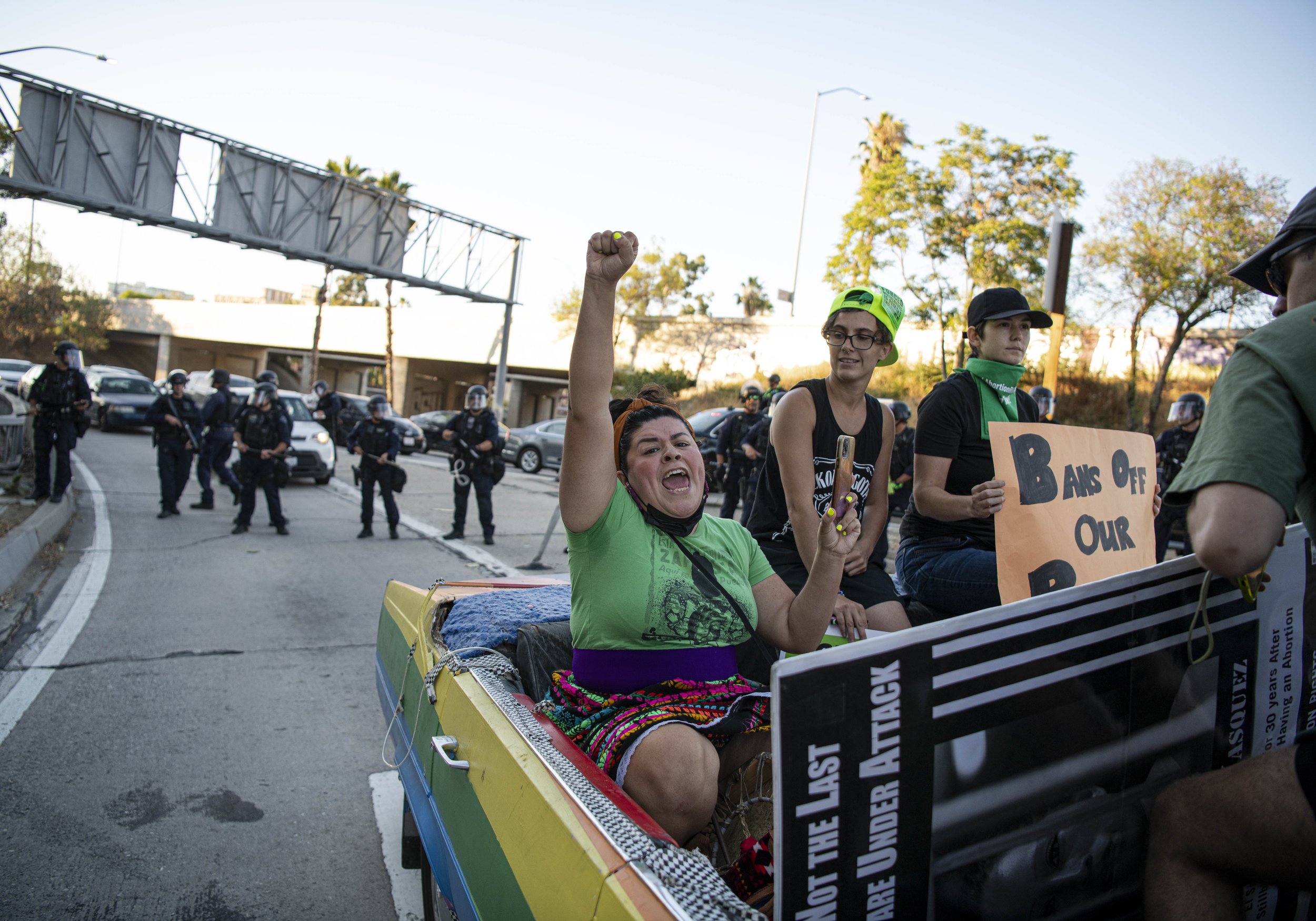  An Abortion Rights raises her hand in protest as officers force the vehicle an occupants to move before arrests were made. (Jon Putman | The Corsair) 