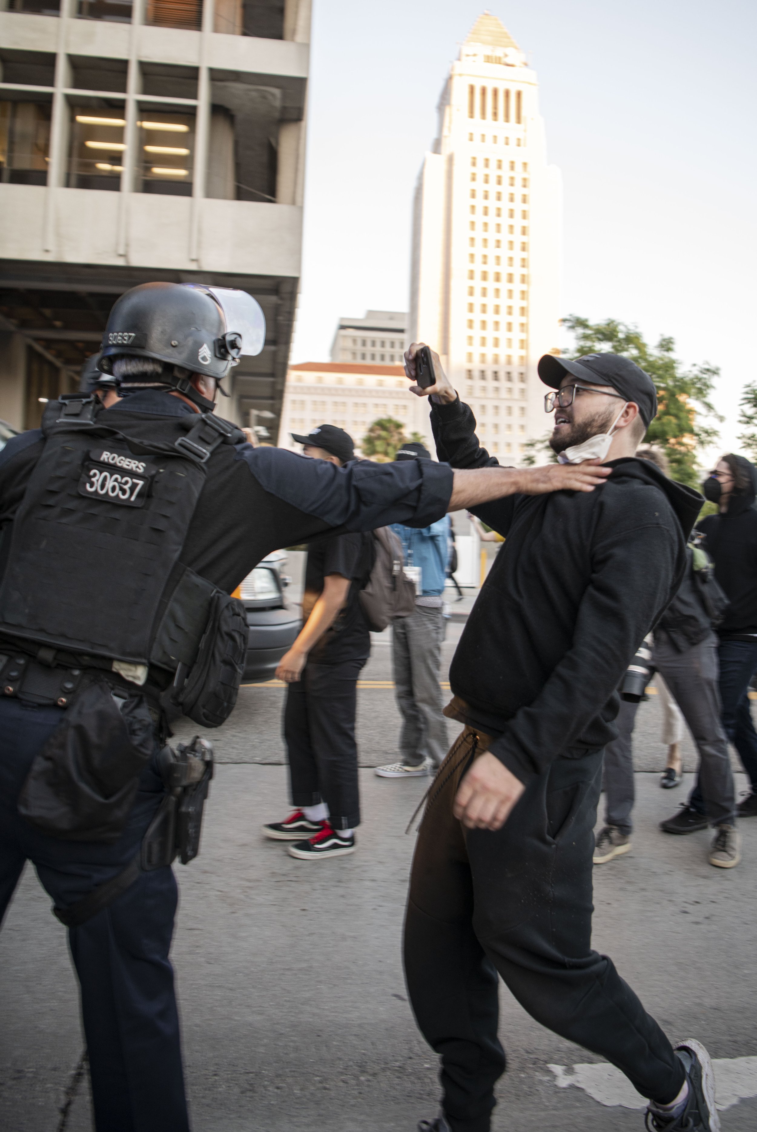  A LAPD officer puts hands on an Abortion rights supporter after the rally cncluded at City Hall. (Jon Putman | The Corsair) 