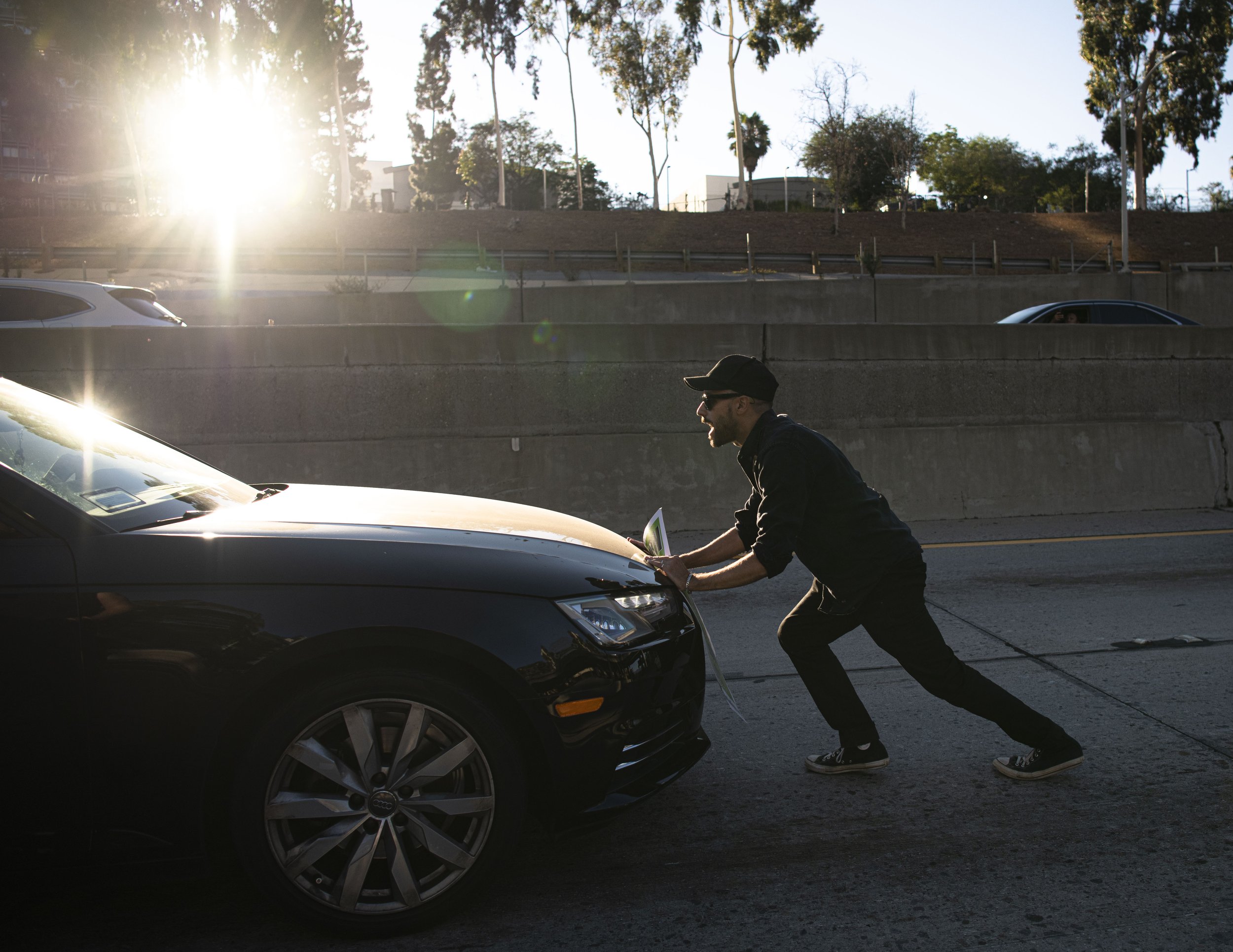  An abortion rights supporter tries to stop traffic as hundreds of protestors rally on to the 110 Freeway downtown Los Angeles. (Jon Putman | The Corsair) 