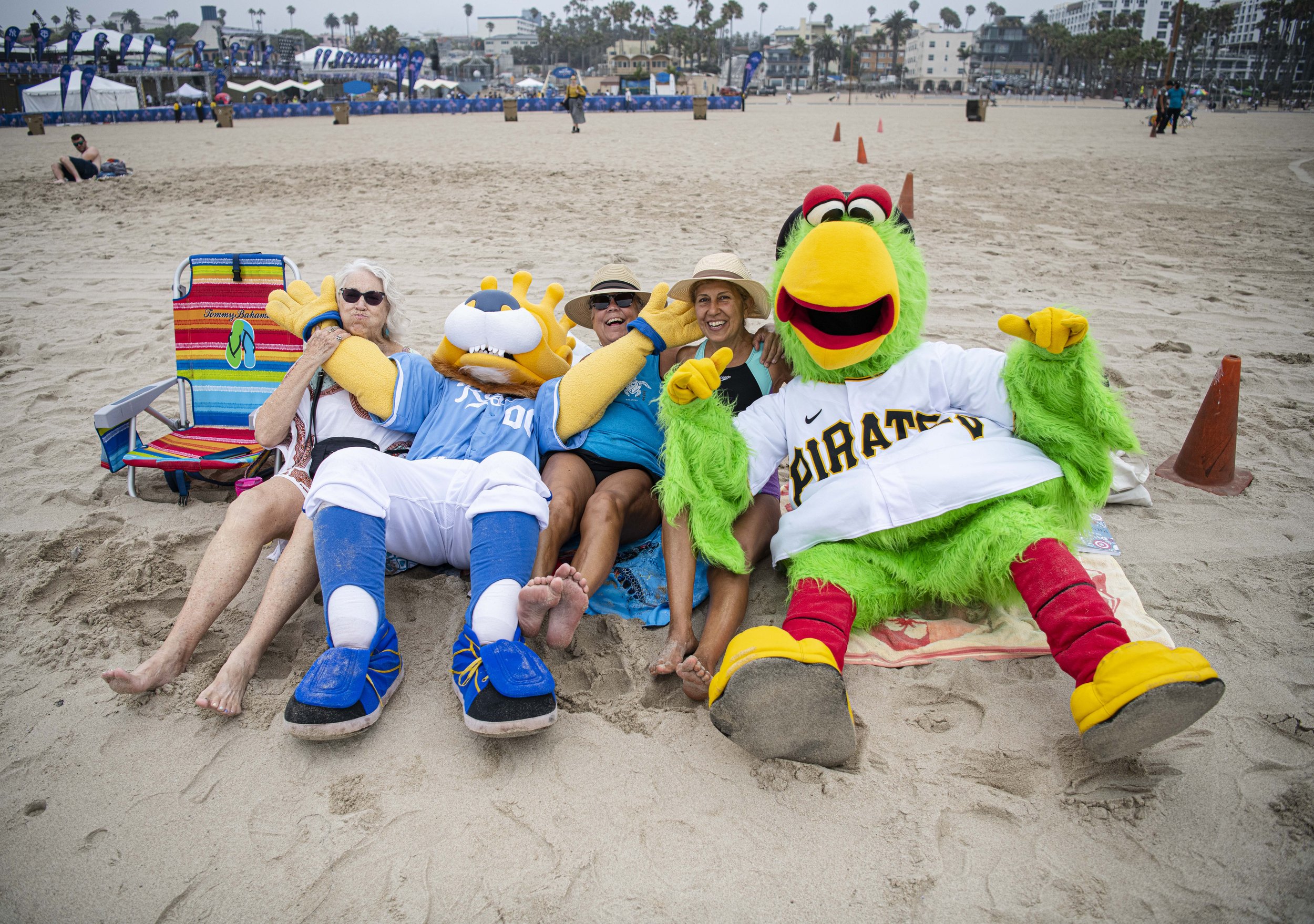  Sluggerrr the Kansas City Royals Mascott (left) and Pirate Parrot the Pittsburgh Pirates Mascott lay with fans on the beach after they conclude their race. (Jon Putman | The Corsair) 