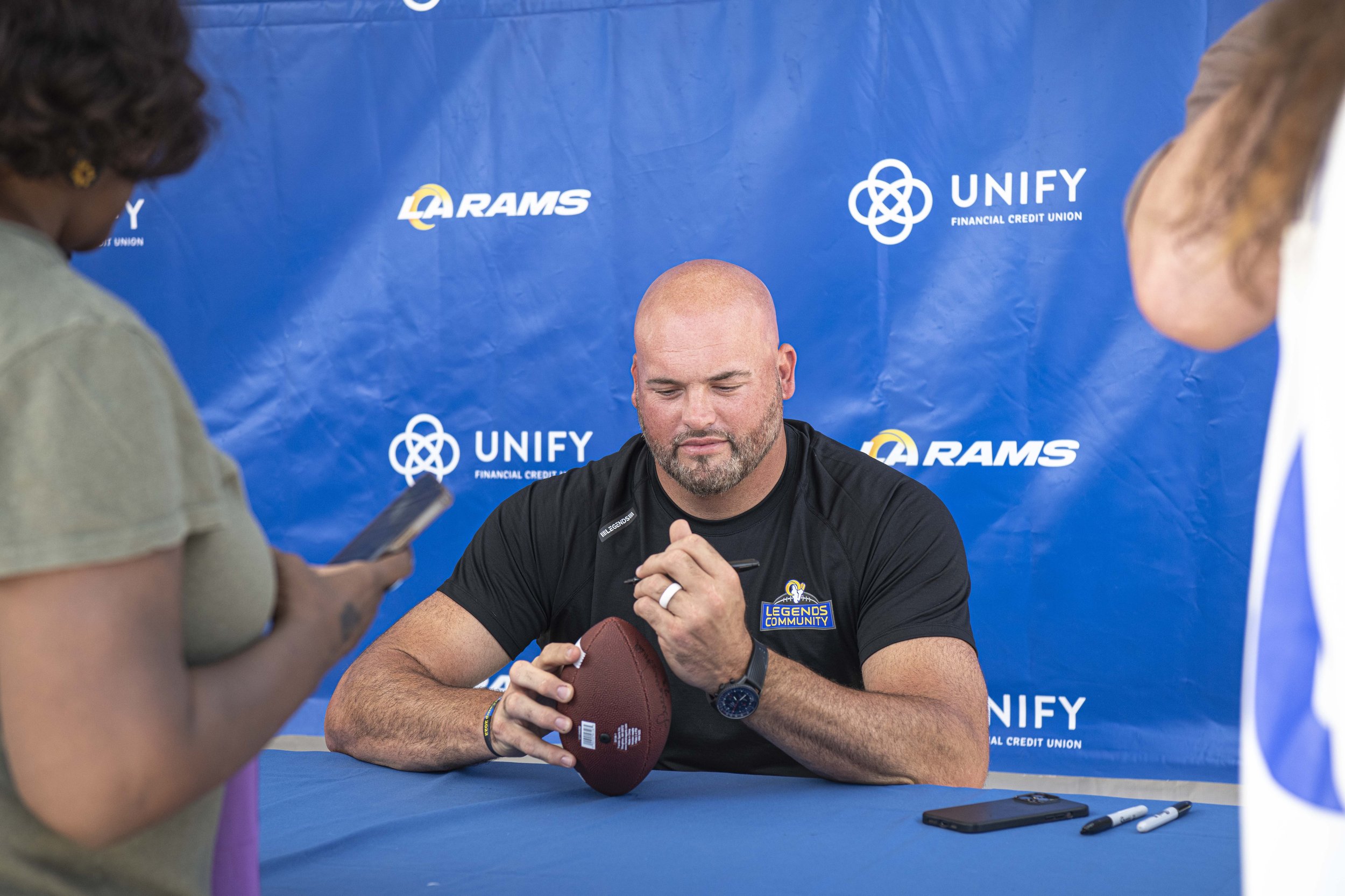  Andrew Whitworth former lineman for the Los Angeles rams signs autographs for fands before the team officially started their first day of trainging camp. (Jon Putman | The Corsair) 