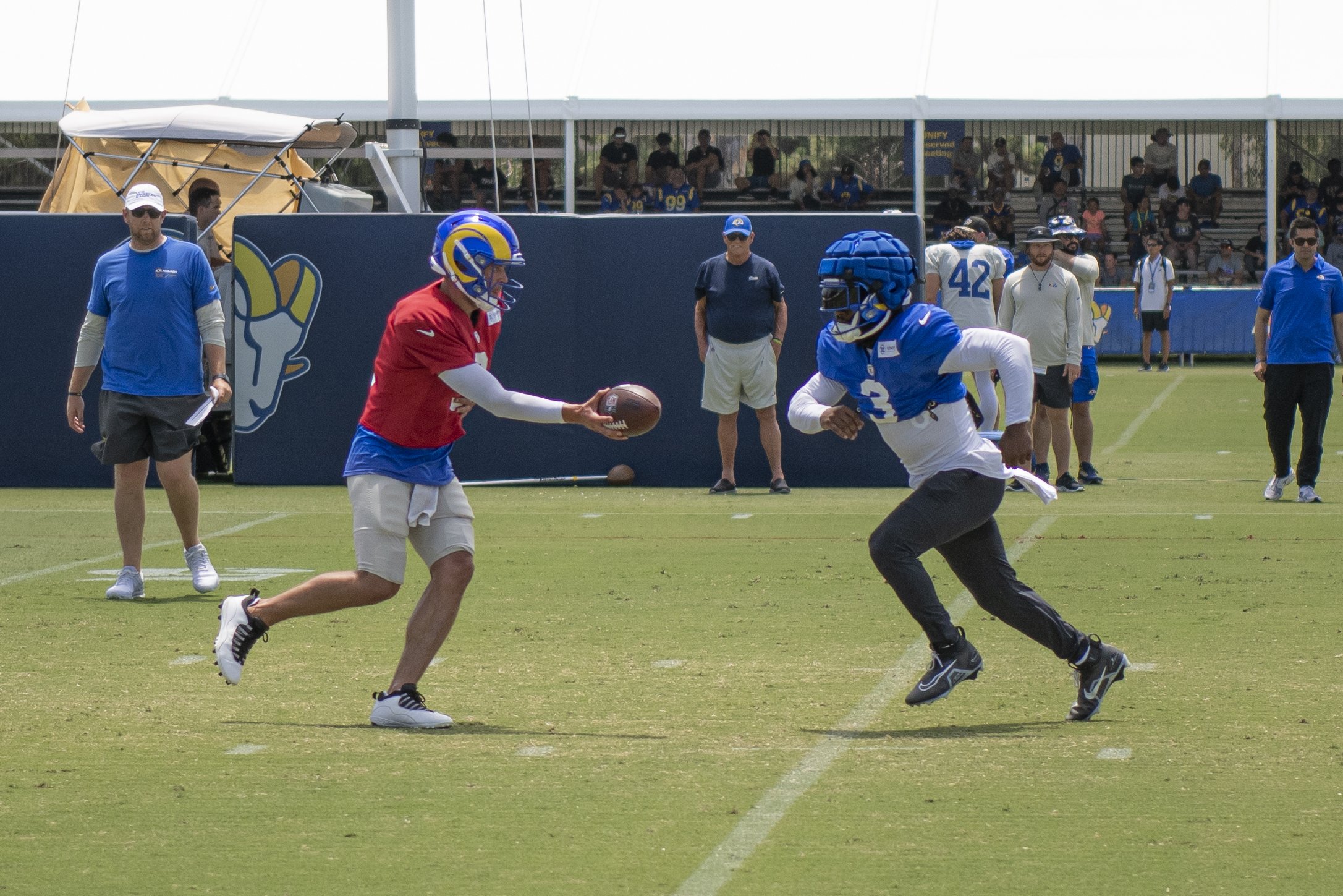  Matthew Stafford (9) the Quarterback for the Los Angeles Rams hands the ball off to waiting runningback Cam Akers (3) during traing camp for the 2022-23 season. (Jon Putman | The Corsair) 