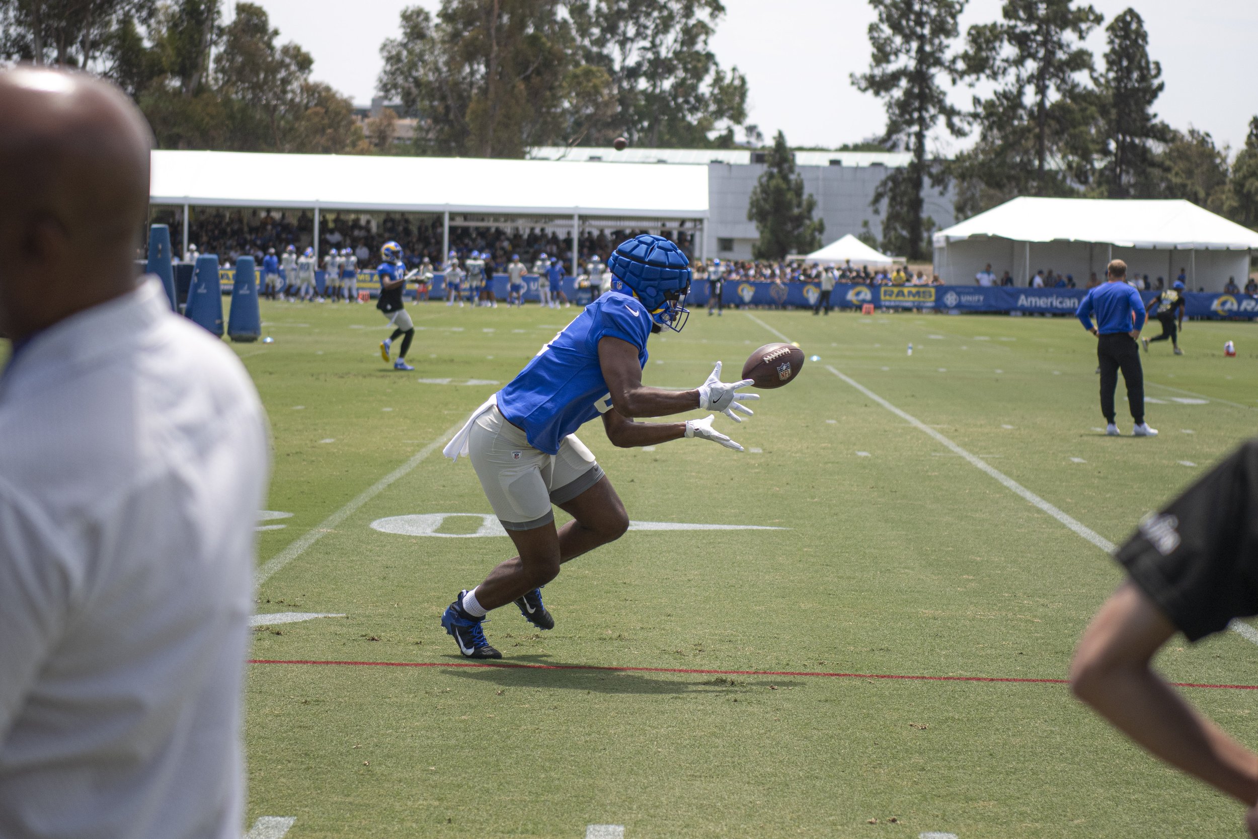  Los Angeles Rams Tight End Roger Carter Jr. (49) reaches for a pass from Quarterback Matt Stafford at their first day of training camp. (Jon Putman | The Corsair) 