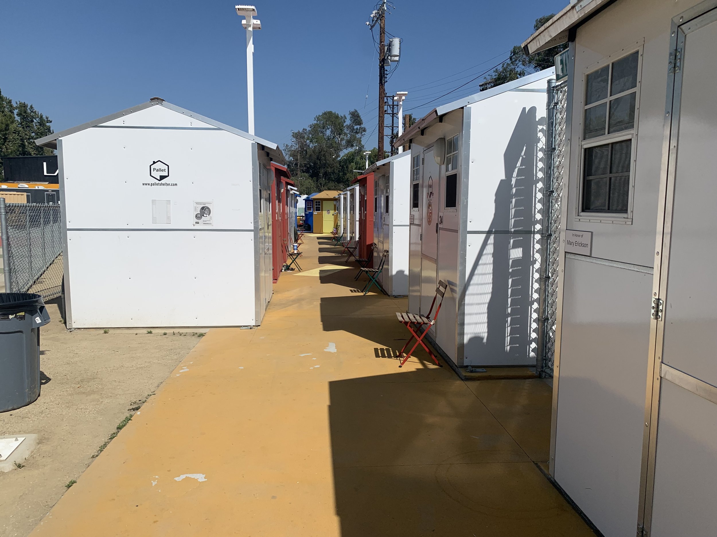  Rows of colorful tiny homes line the Chandler Blvd. Tiny Home Village on Wednesday, May 25, 2022. Photo by Chana Kaplan. 