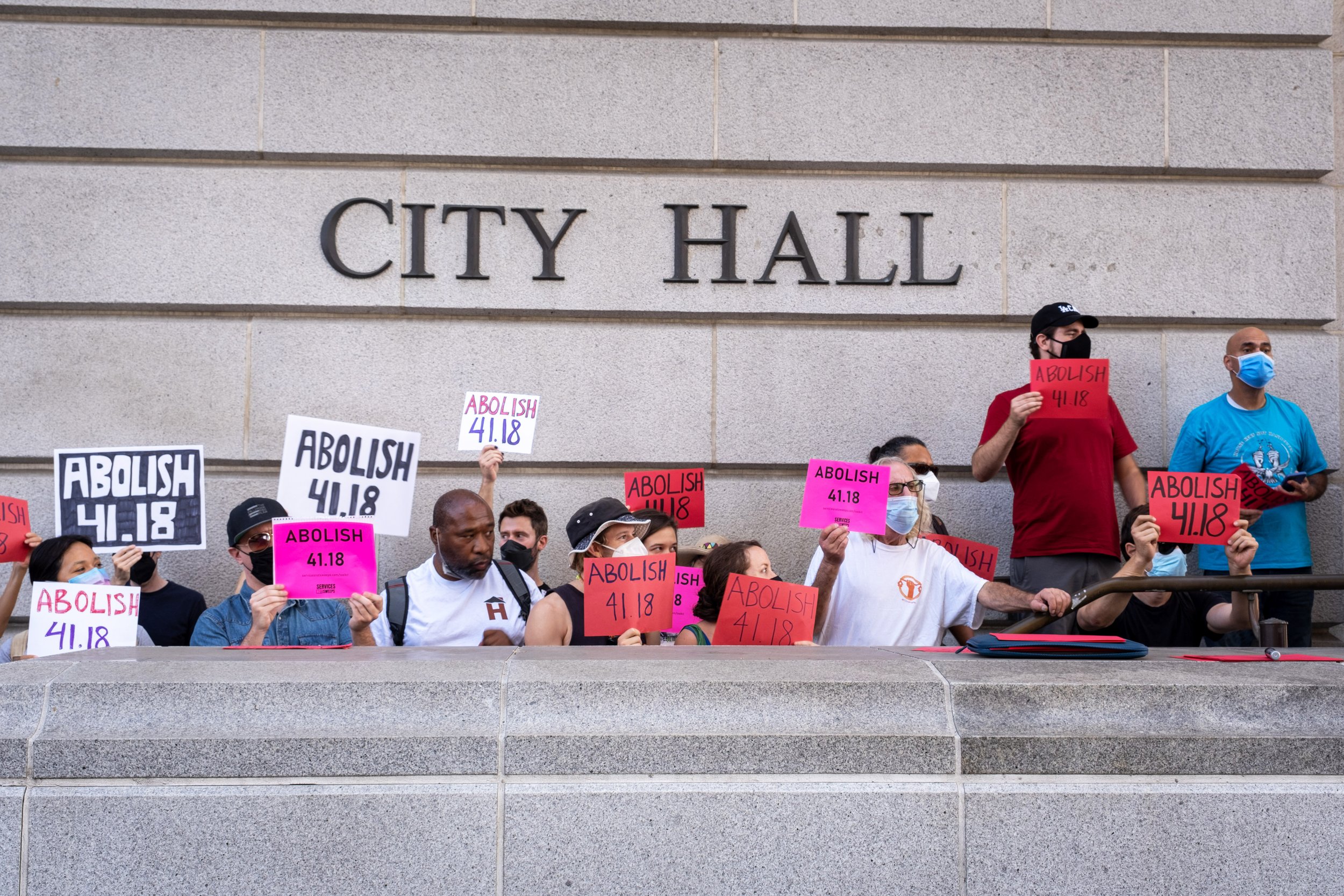  Los Angeles community members and activists gather outside of City Hall before the public hearing. Speeches are given by activists, who demand that municipal code 41.18 be abolished. Los Angeles City Hall. August 9, 2022. (Anna Sophia Moltke | The C