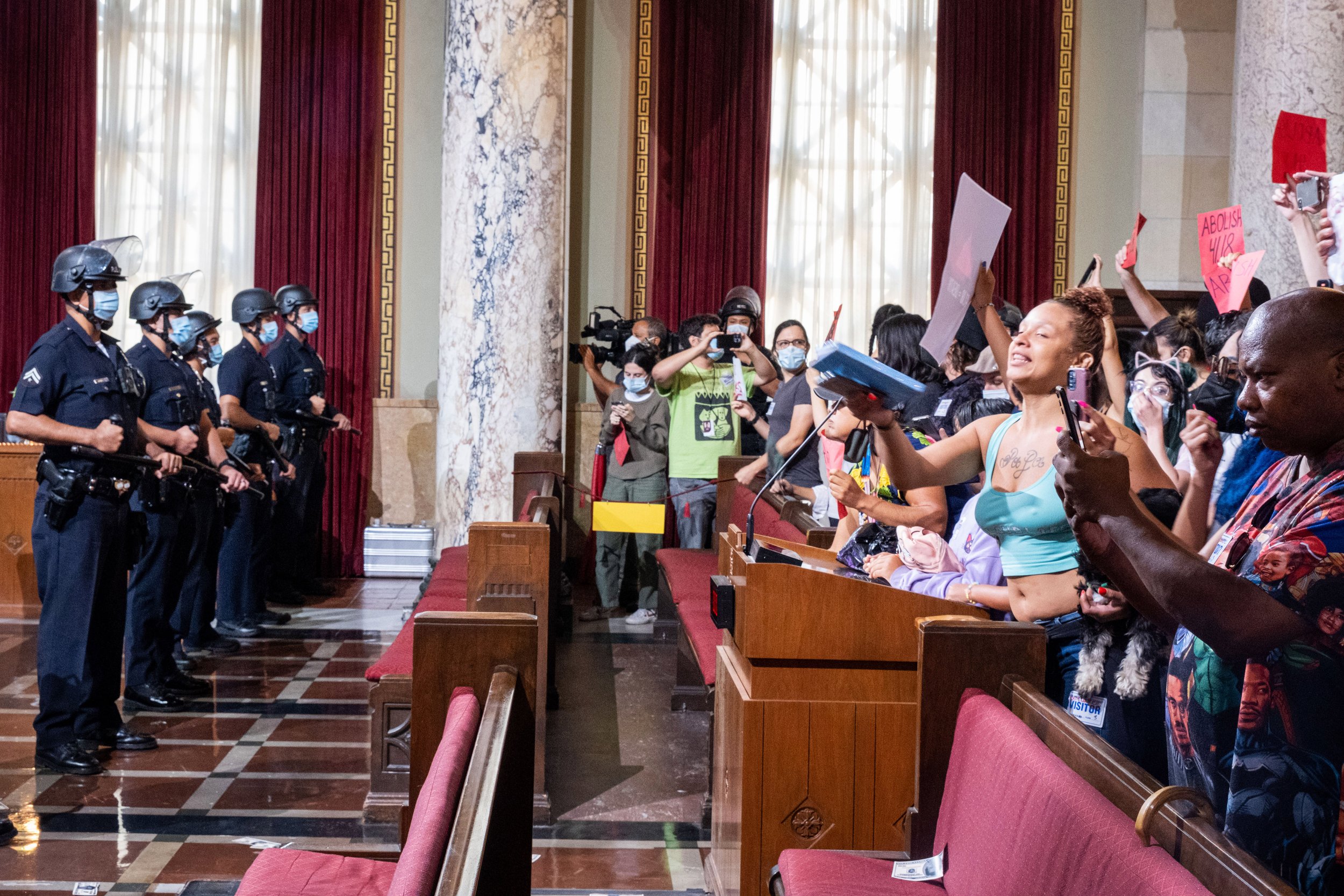  Los Angeles community members and activists voice their frustration after Ricci Sergirnko and Ms. Italy were detained, ending the official public hearing. Los Angeles City Hall on August 9, 2022. (Anna Sophia Moltke | The Corsair) 