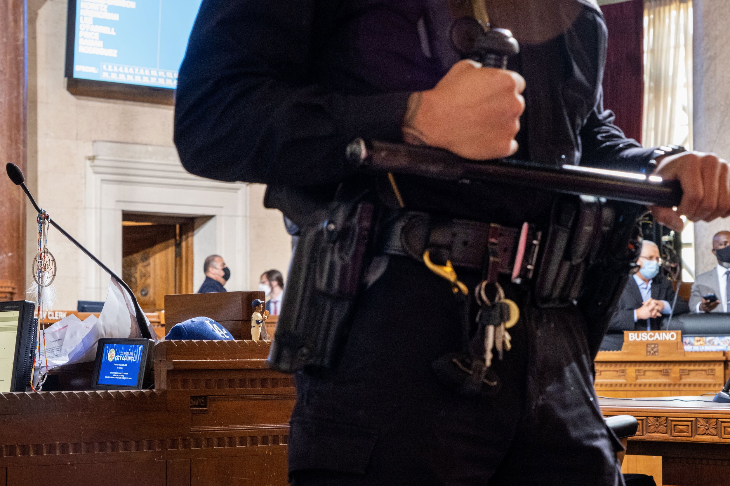  A police officer stands by after two attendees at the public hearing were detained. Los Angeles City Hall on August 9, 2022. (Anna Sophia Moltke | The Corsair) 