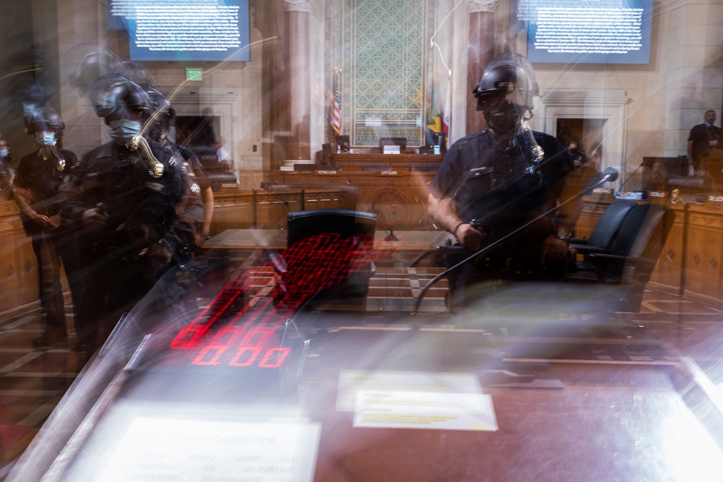  Police officers stand by after two attendees at the public hearing were detained. The crowd was ordered to disperse, and the public hearing was ended. Los Angeles City Hall on August 9, 2022. (Anna Sophia Moltke | The Corsair) 