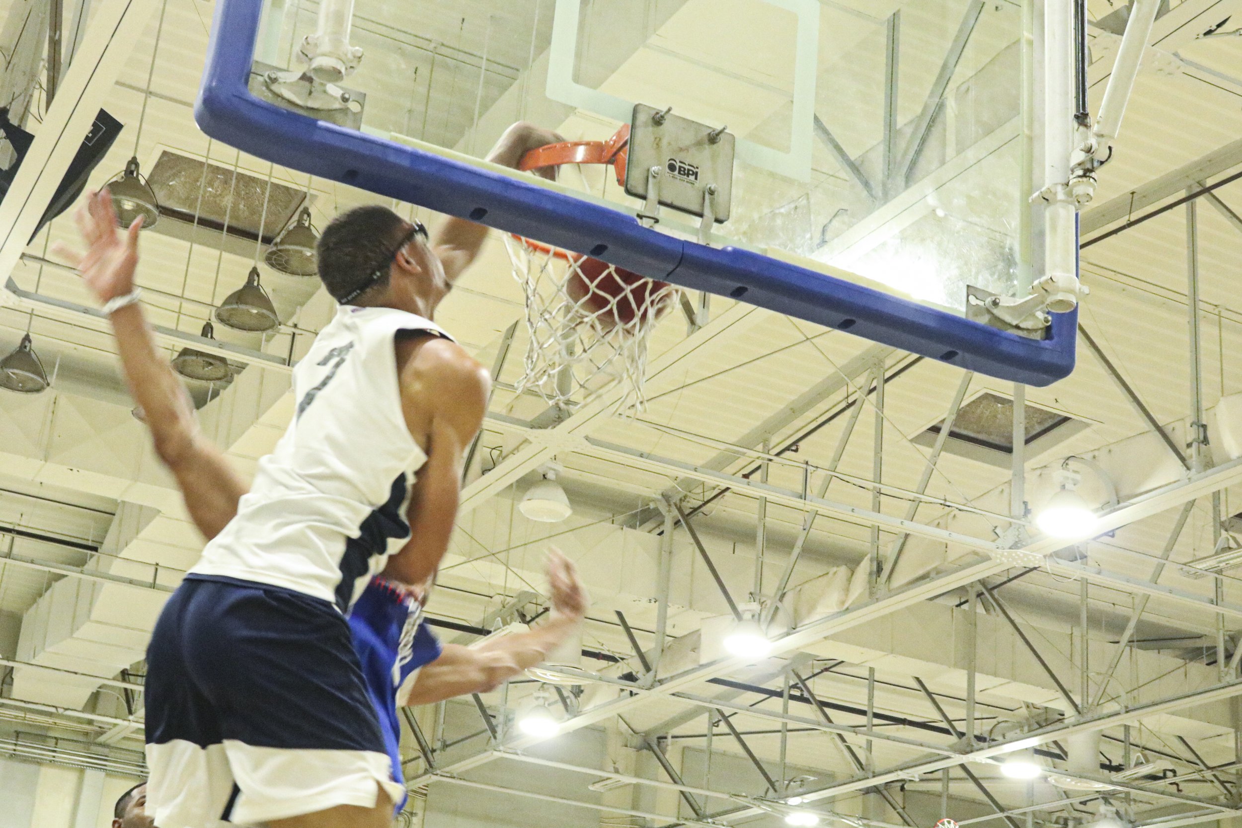  Professional basketball player Myles Bridges throws down a dunk that would later propel him to be chosen as the game’s MVP. 