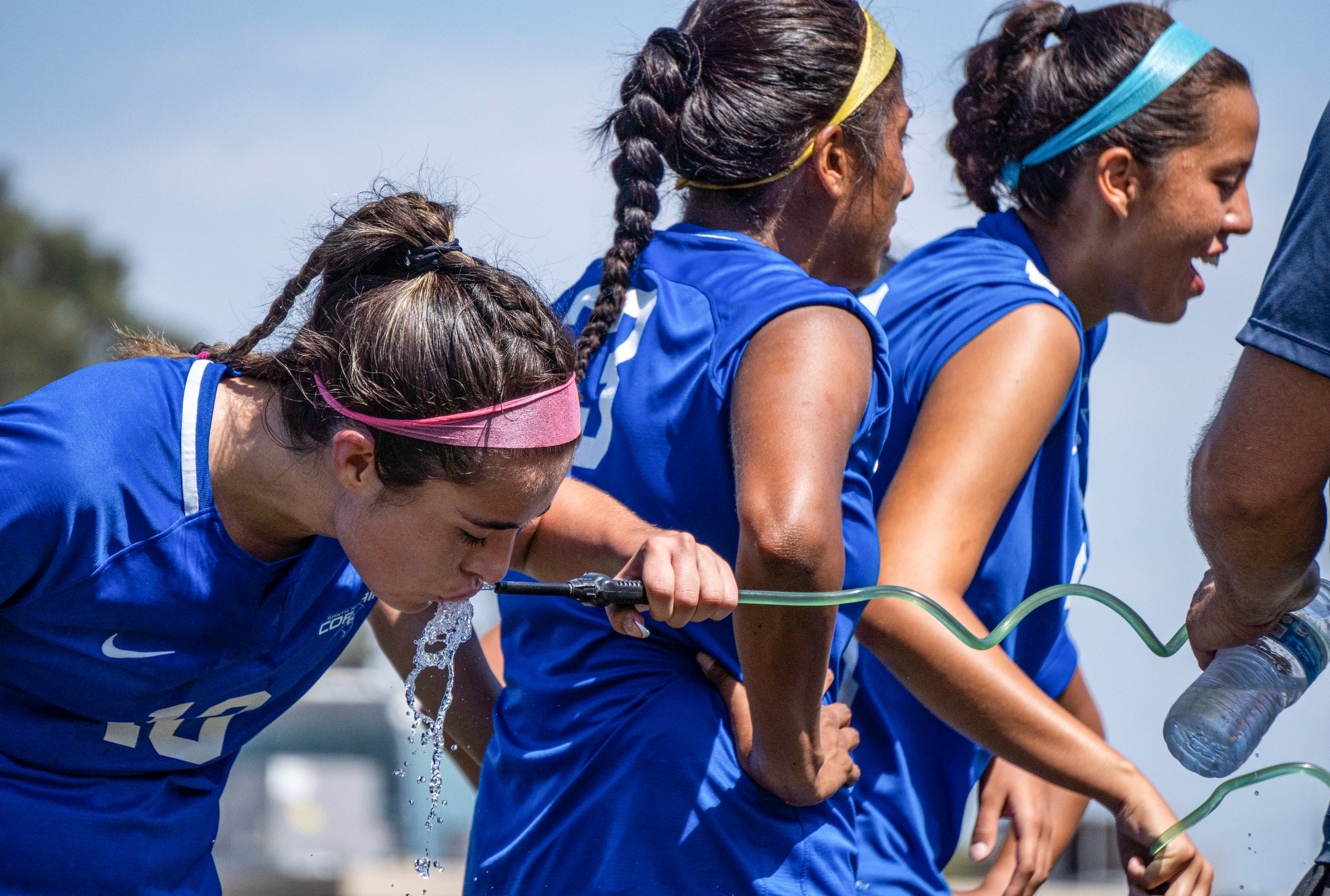  Santa Monica College's Women's Soccer Midfielder Ali Alban (10) quenches her thirst with a spray of refreshing water underneath Santa Monica's hot afternoon sun. The Corsair Field in Santa Monica, Calif. On Friday, September 2, 2022. (Tsen Ee Lin | 
