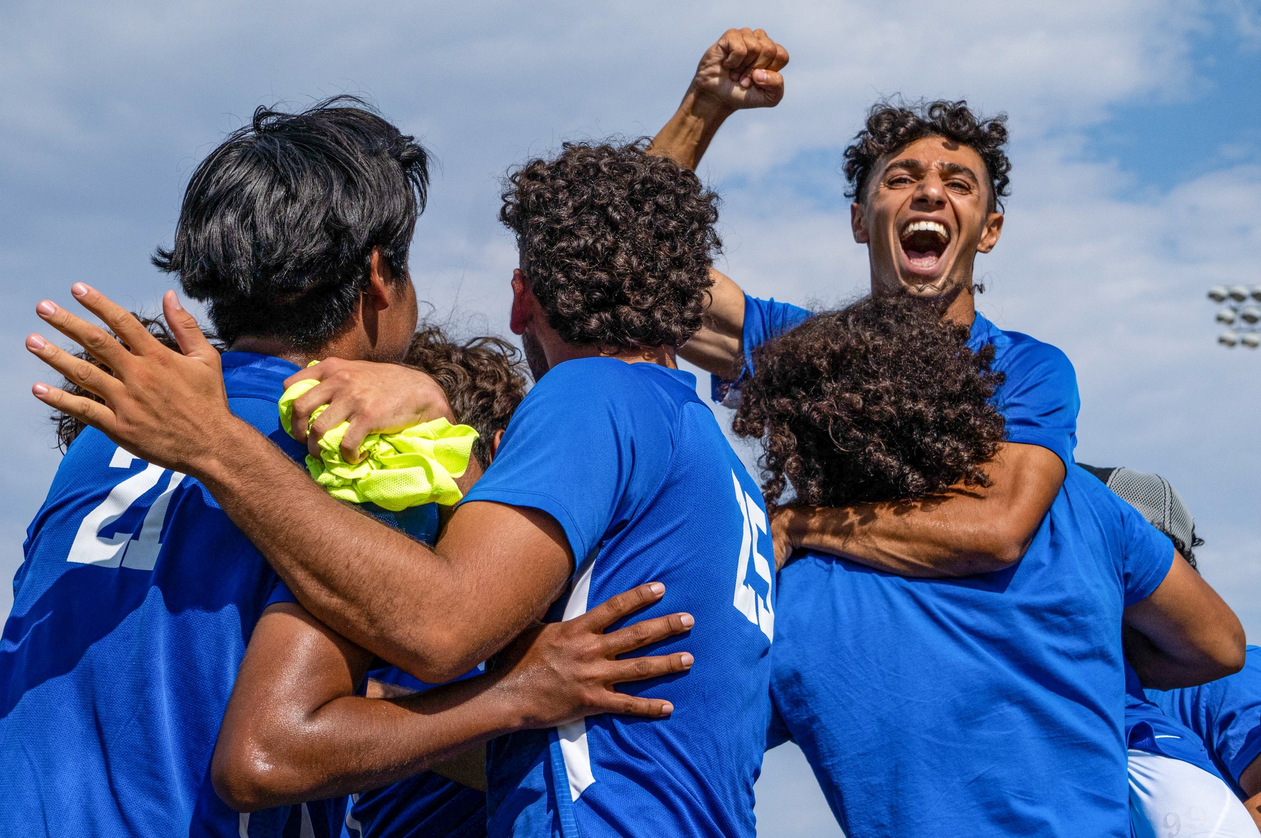  (L to R) Santa Monica College Corsairs Men’s Soccer players Elvis Santiago (21), Alvin Rivas (15), Roey Kivity (10) and teammates go in for a celebratory embrace after scoring their first goal against the El Camino Warriors in the first half of the 