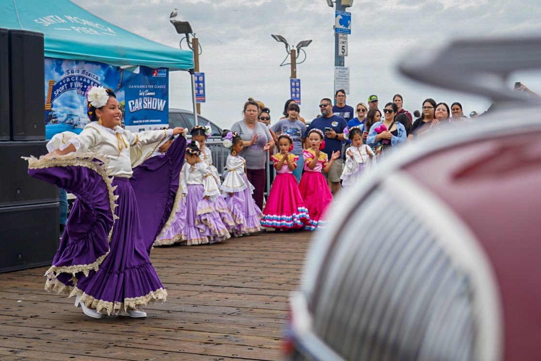  A young dancer from the Ballet Folklórico de Santa Monica performs during the End of Summer Car Show in Santa Monica, Calif. Saturday, Sept 10 2022. Folklórico dancers often wear costumes that celebrate traditional Mexican folkloric characters.. (An