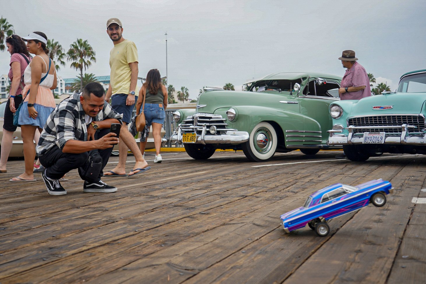  An attendee observes an RC lowrider during the End of Summer Car Show in Santa Monica, Calif. Saturday, Sept 10 2022. The Pico Youth & Family Center organized the event to celebrate hispanic culture throughout West Los Angeles. (Anthony Clingerman |