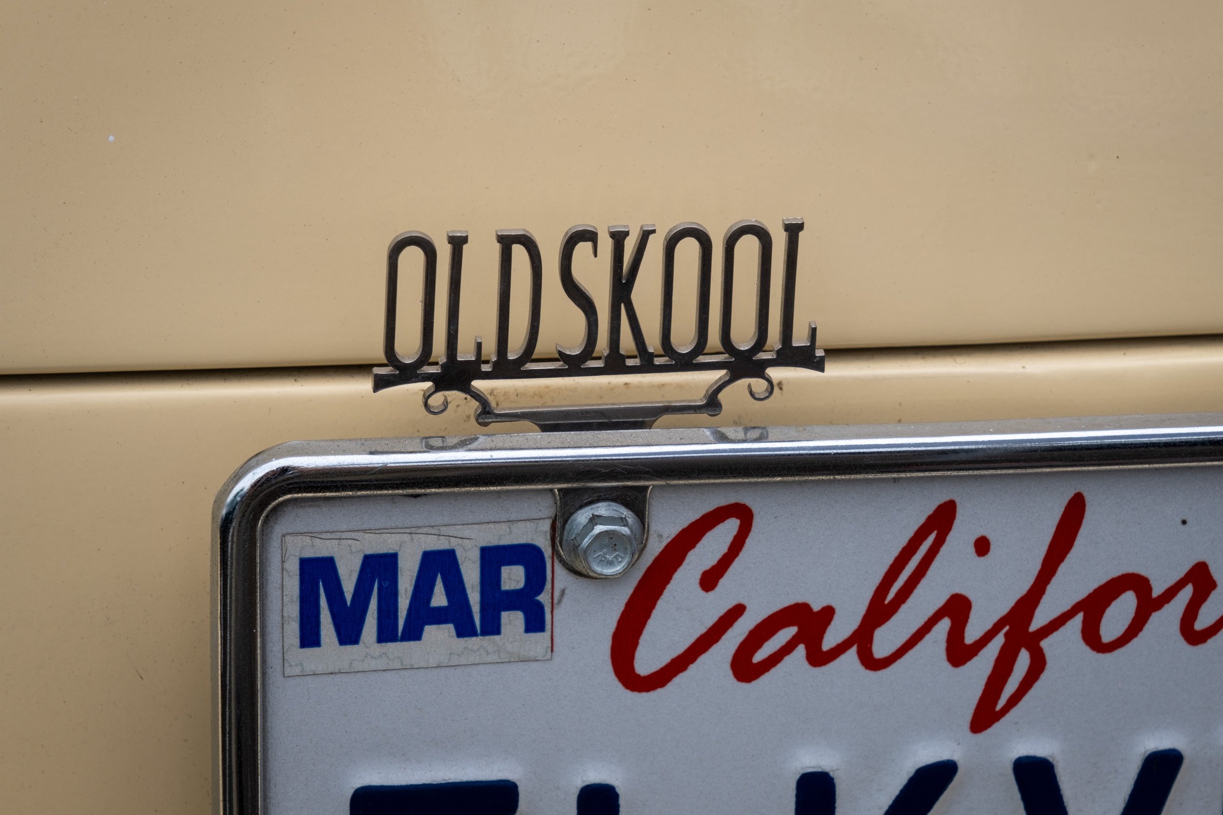  Silver plaque tops the license plate of a classic car. (Anna Sophia Moltke | The Corsair) 