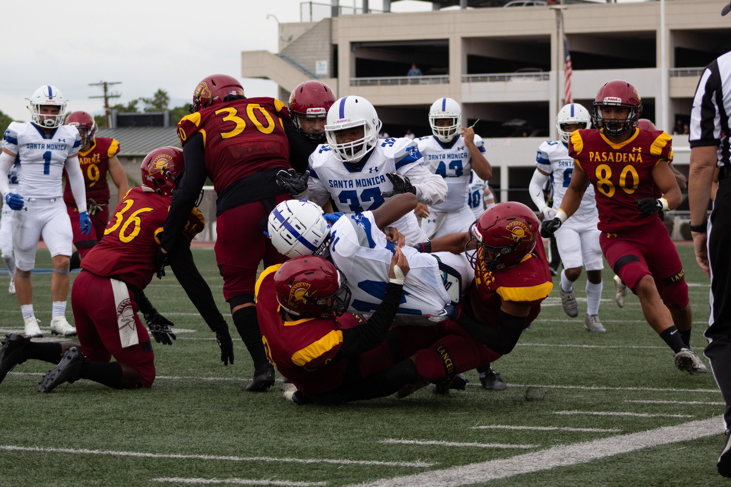  Jaboree Thornton of the Corsair football team being tackled by players from Pasadena City's Lancers during a game at Santa Monica College. The Lancers won with a final score of 27-20, on September 10, 2022, at Santa Monica College, Santa Monica, Cal