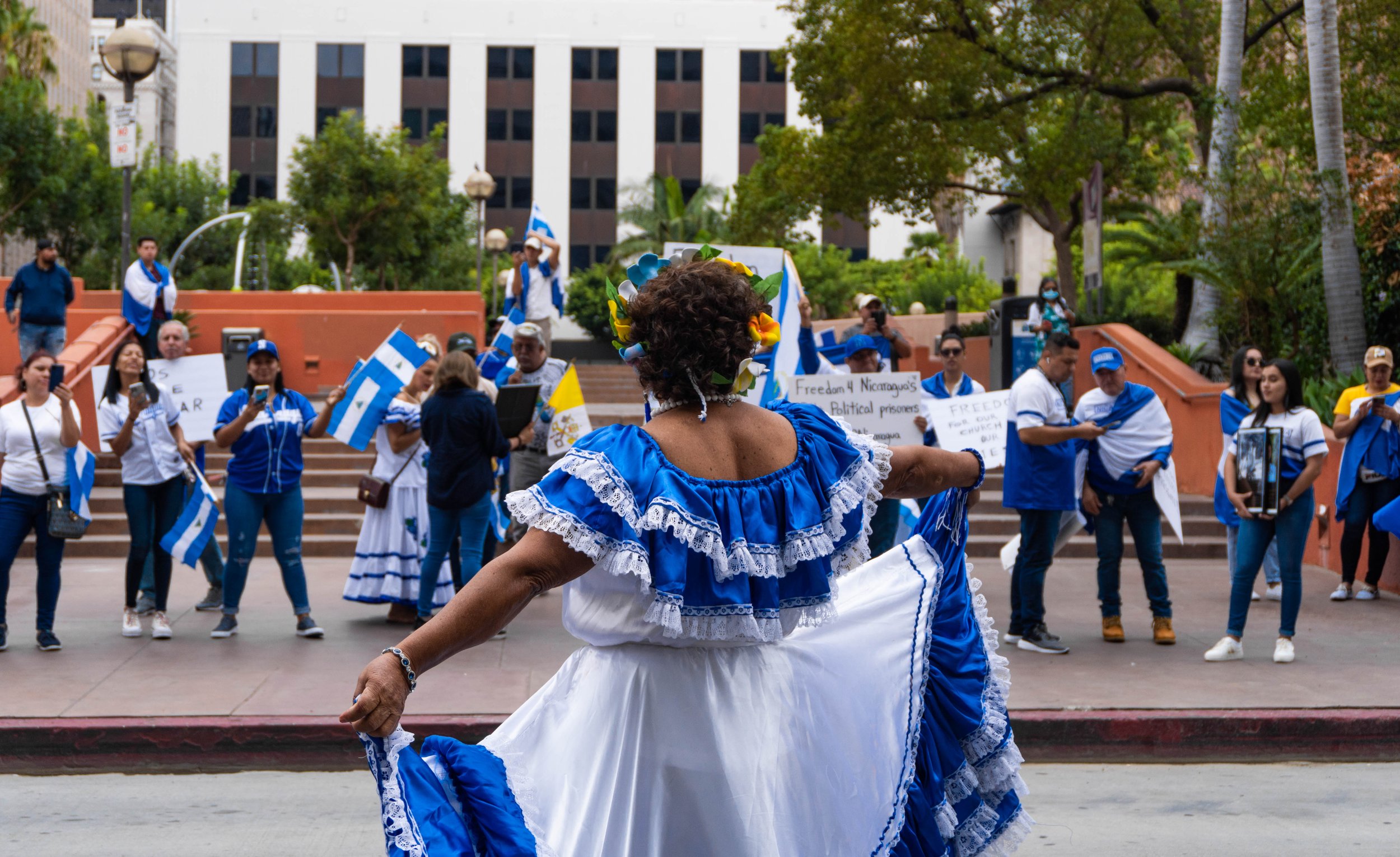  Flor Ramirez stands before other fellow Nicaraguans at Pershing Square as they protest against the Nicaraguan government's dictatorship. Sept. 17, 2022. Los Angeles, CA. (Ee Lin Tsen | The Corsair) 