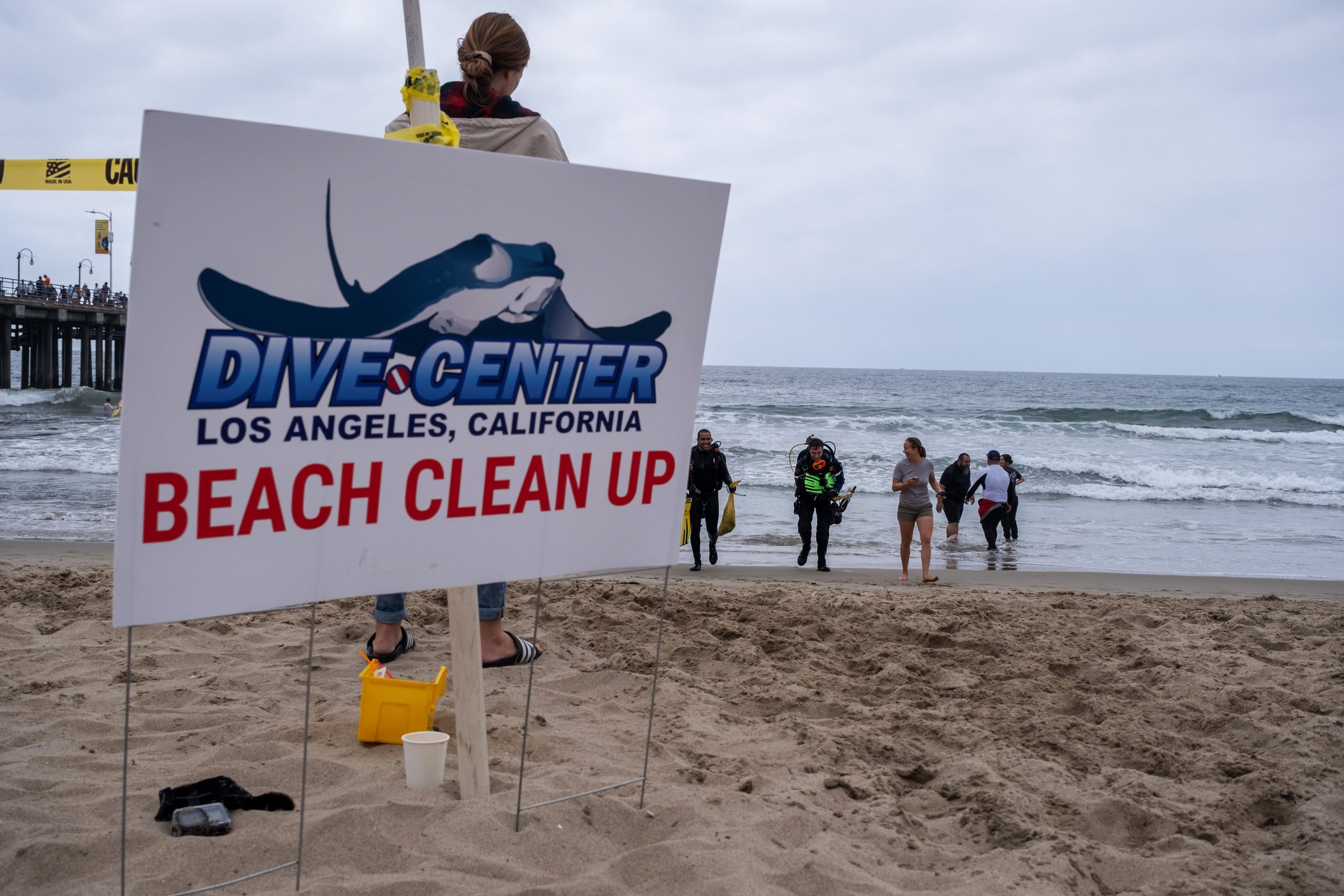  In collaboration with Heal the Bay, divers from Dive Center participate in the Coastal Cleanup Day event. Diving into the waters surrounding the Santa Monica Pier, they find a wide range of trash. Coastal Cleanup Day, led by Heal The Bay in Santa Mo