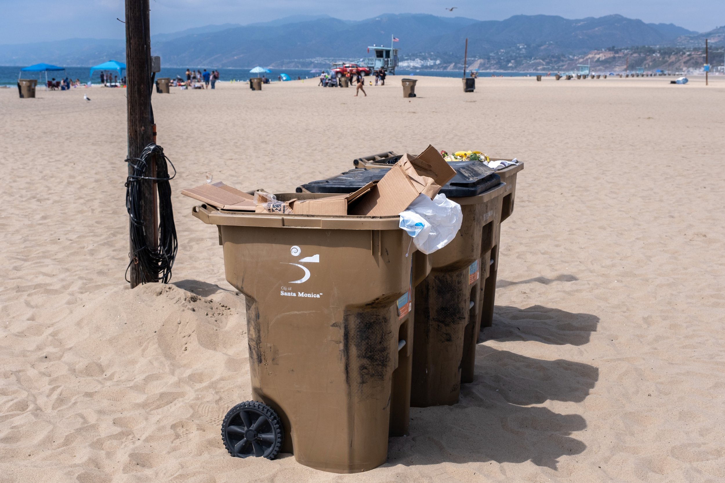  Three garbage cans, full of trash collected by participants and volunteers who attended the  Coastal Cleanup Day, led by Heal The Bay in Santa Monica Calif. on Saturday, September 17, 2022. (Anna Sophia Moltke | The Corsair) 