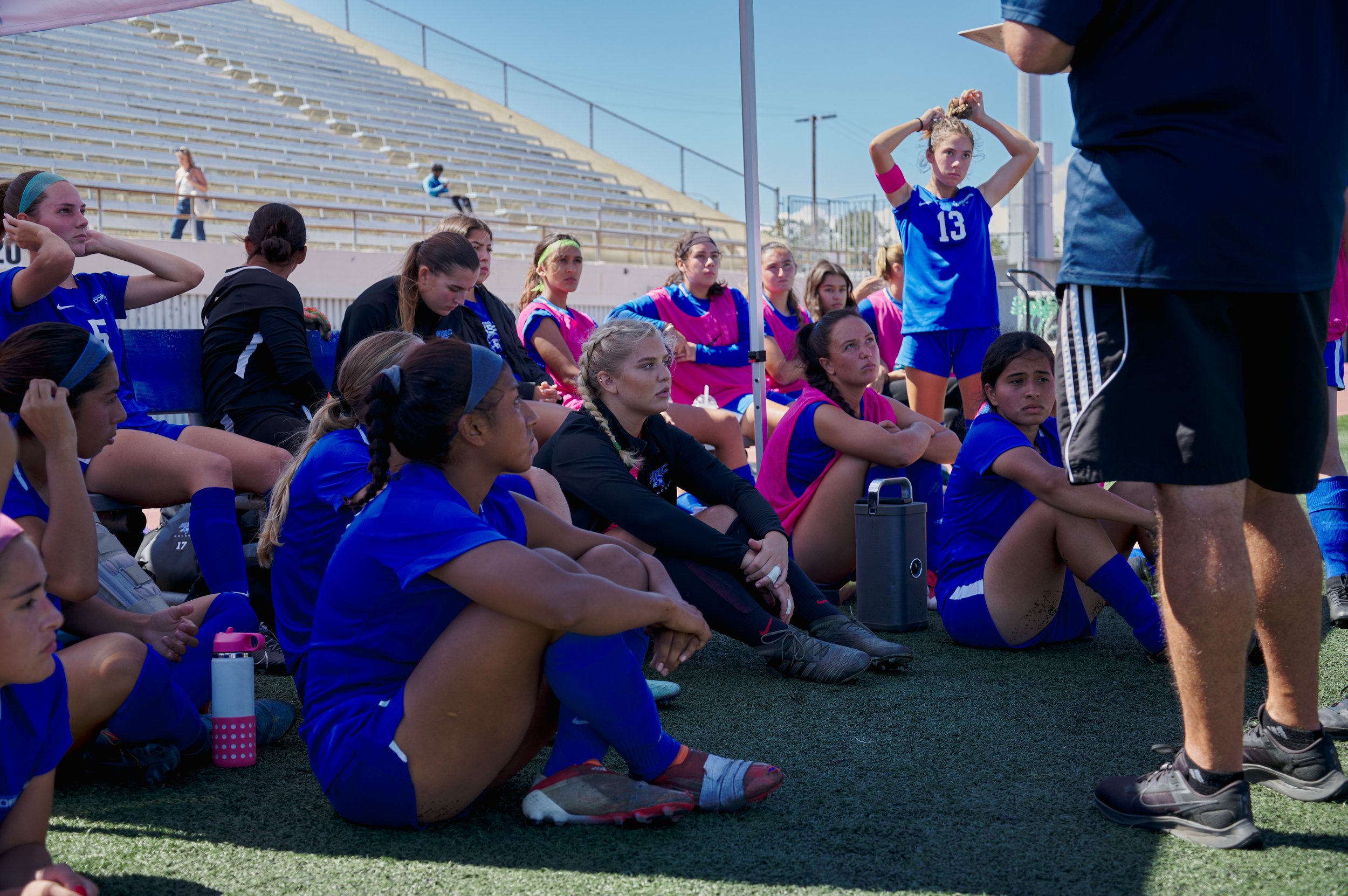  Members of the Santa Monica College Corsairs Women's Soccer team listen to Head Coach Aaron Benditson during intermission at the game against the Santa Barbara City College Vaqueros on Tuesday, Sept. 20, 2022, at Corsair Field. The game ended in a 1