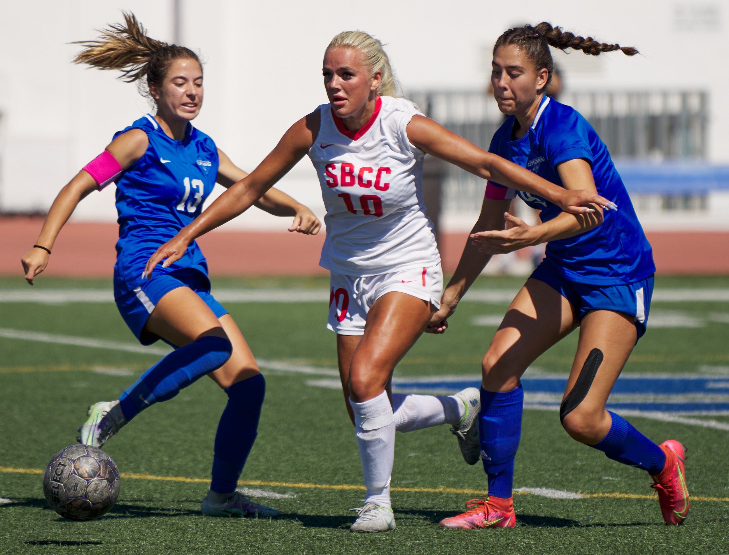  Santa Barbara City College Vaqueros' Helene Lervik keeps control of the ball away from the Santa Monica College Corsairs' Sophie Doumitt (left) and Alexia Mallahi (right) during the women's soccer game on Tuesday, Sept. 20, 2022, at Corsair Field in