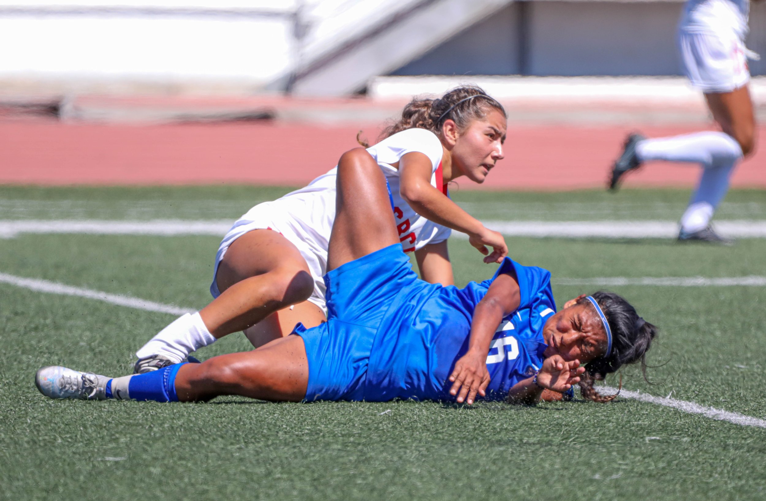  Santa Barbara City College(SBCC) Vaqueros Santa Monica College(SMC) Corsairs midfeilder Diana Gaspar (16,R) midfielder Gizela Zermeno (8,L) both on the ground after Zermeno slid tackled Gaspar who then recieved a yellow card on Tuesday, Sept. 20 at 