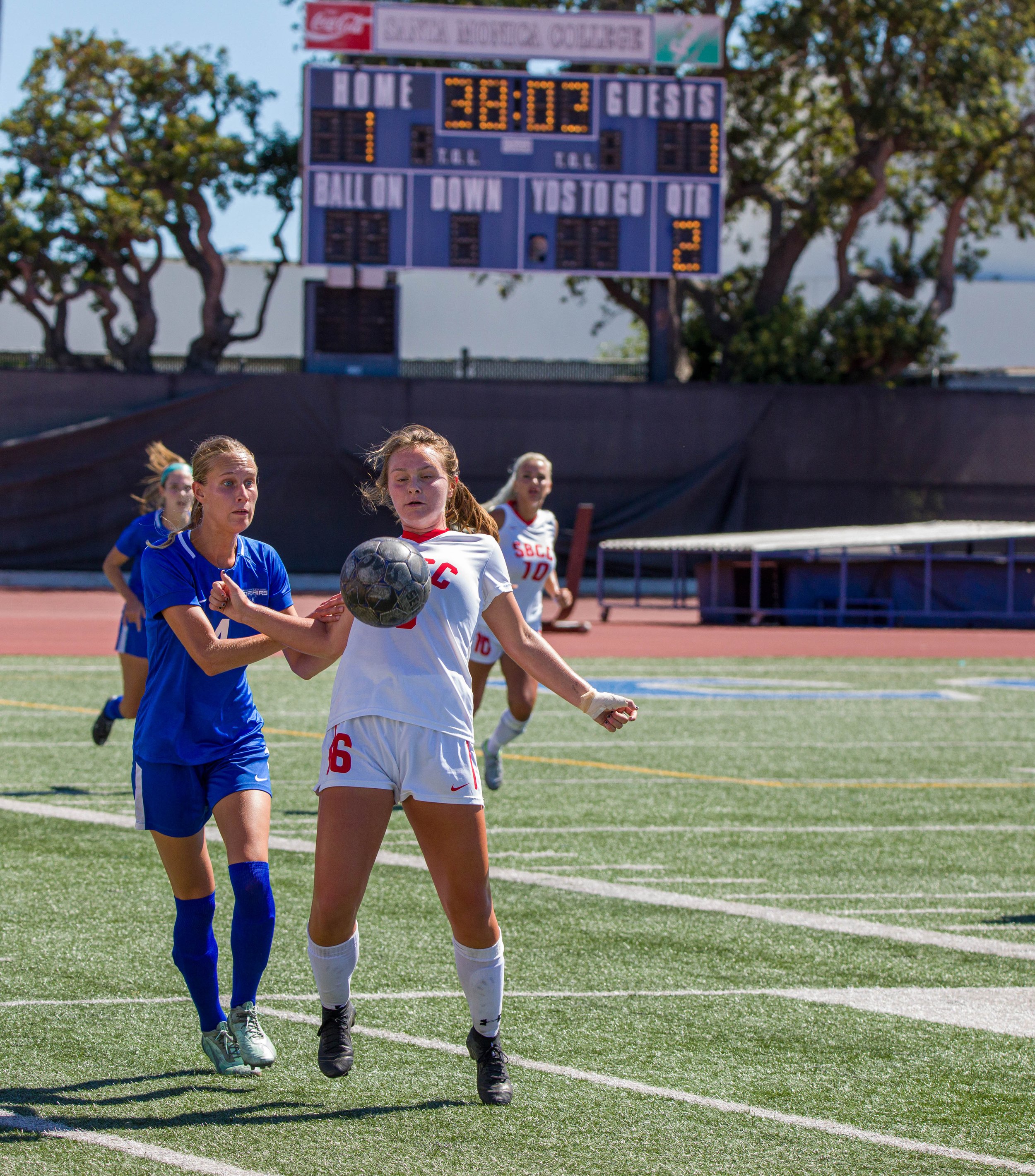  Santa Monica College(SMC) Corsair forward Emma Rierstam trying to get possesion of the ball while Santa Barbara City College(SBCC) midfielder Hannah Mclain (6,R) stopping the ball with her chest on Tuesday, Spet. 20 at the Corsair Feild in Santa Mon