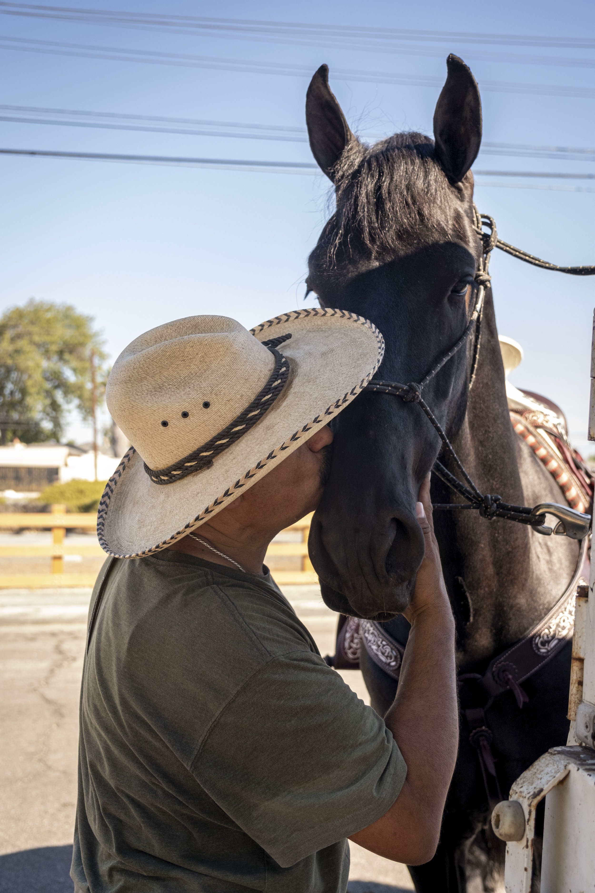  Ricardo Vasquez gives his horse Lencho a kiss. Vasquez explains that this is Lencho’s first event in Compton, Calif. on Sunday, Sept 25. (Anna Sophia Moltke | The Corsair) 