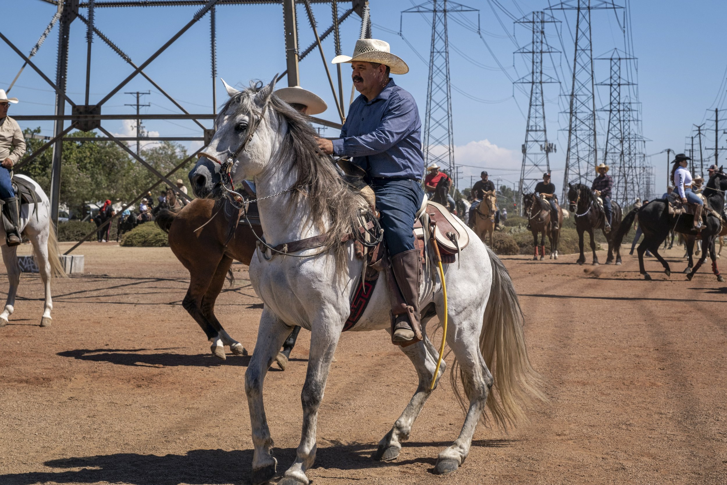  Some riders gather on the land that is parallel between Greenleaf Blvd and Walton Middle School, where a row of electrical towers form a line. Compton, Calif. on Sunday, Sept 25. (Anna Sophia Moltke | The Corsair) 