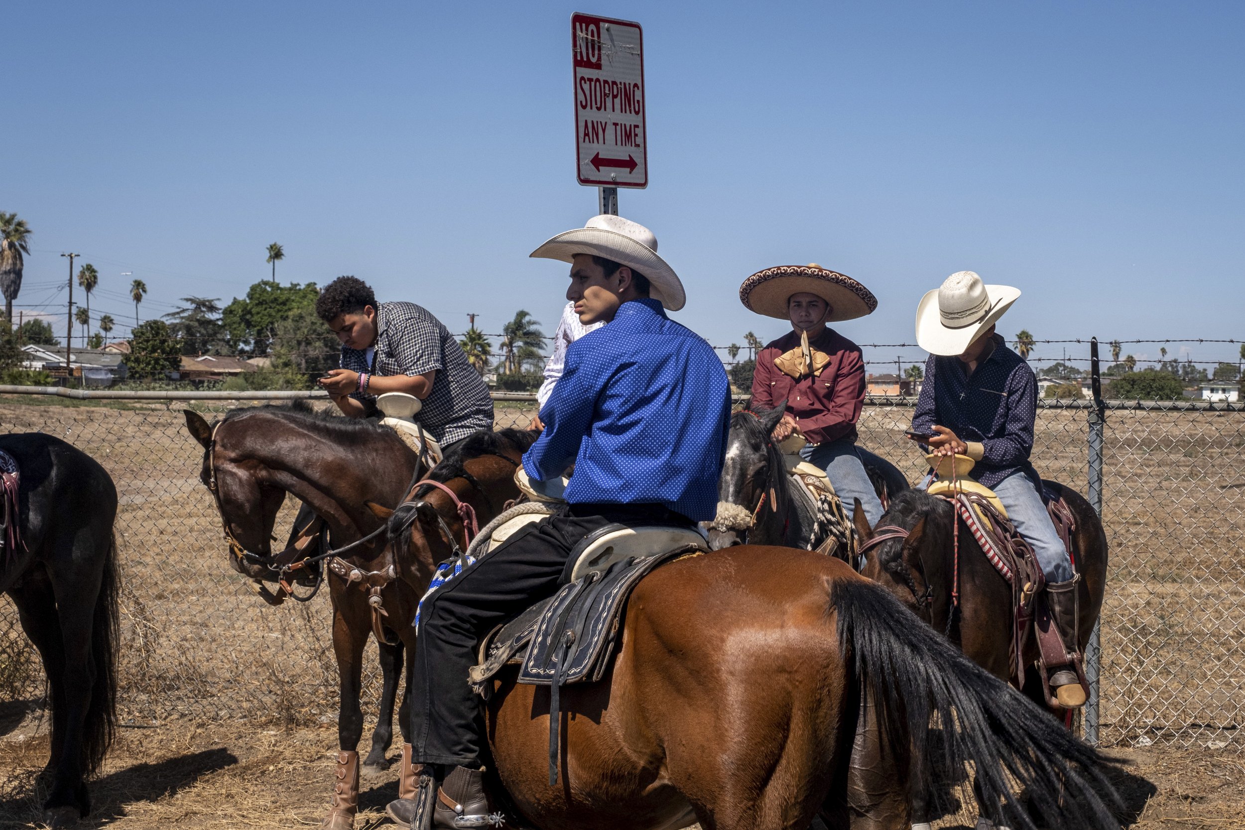  Riders take a break by the empty Brownfield site, where Connecting Compton has goals of building a Multicultural Equestrian Center, with the approval from the City of Compton, Calif. on Sunday, Sept 25. (Anna Sophia Moltke | The Corsair) 