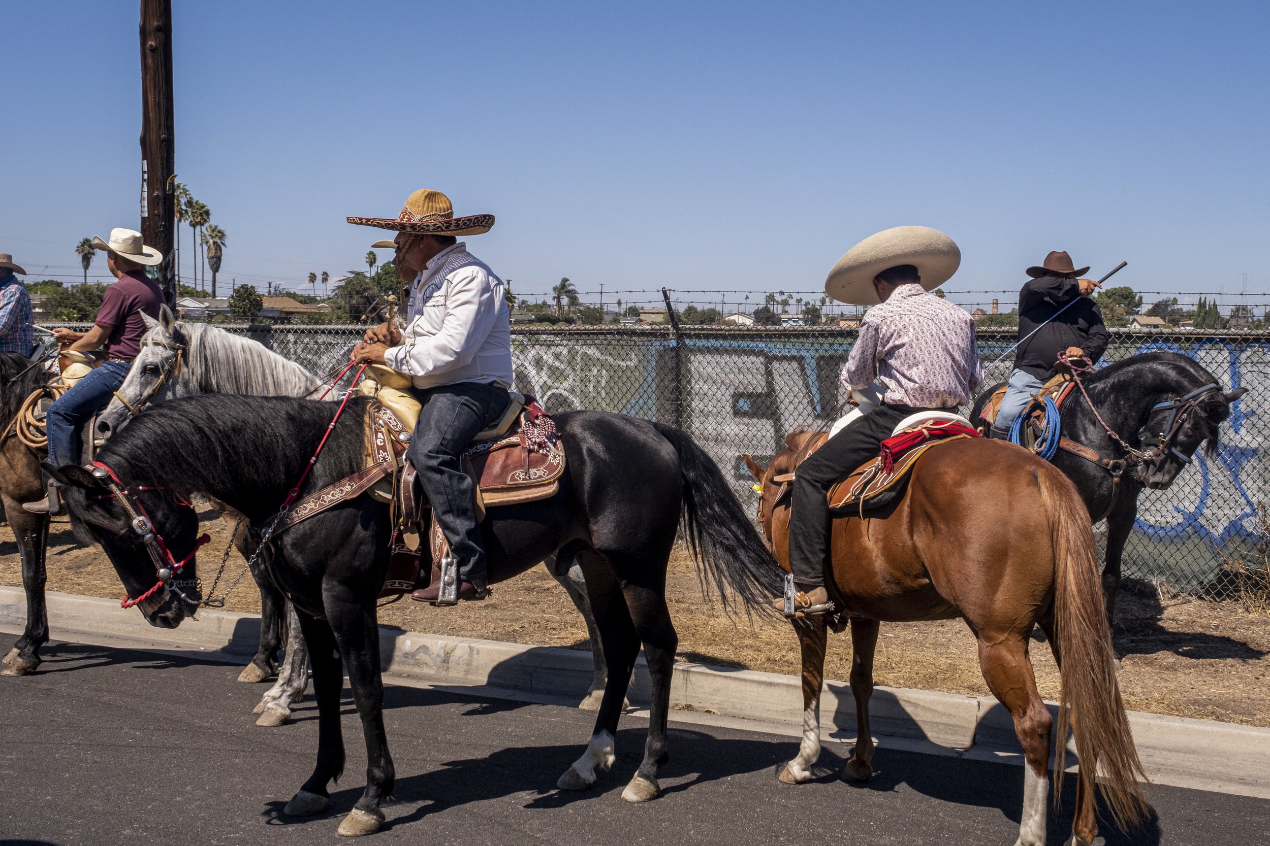  Riders take a break by the empty Brownfield site, where Connecting Compton has goals of building a Multicultural Equestrian Center, with the approval from the City of Compton, Calif. on Sunday, Sept 25. (Anna Sophia Moltke | The Corsair) 