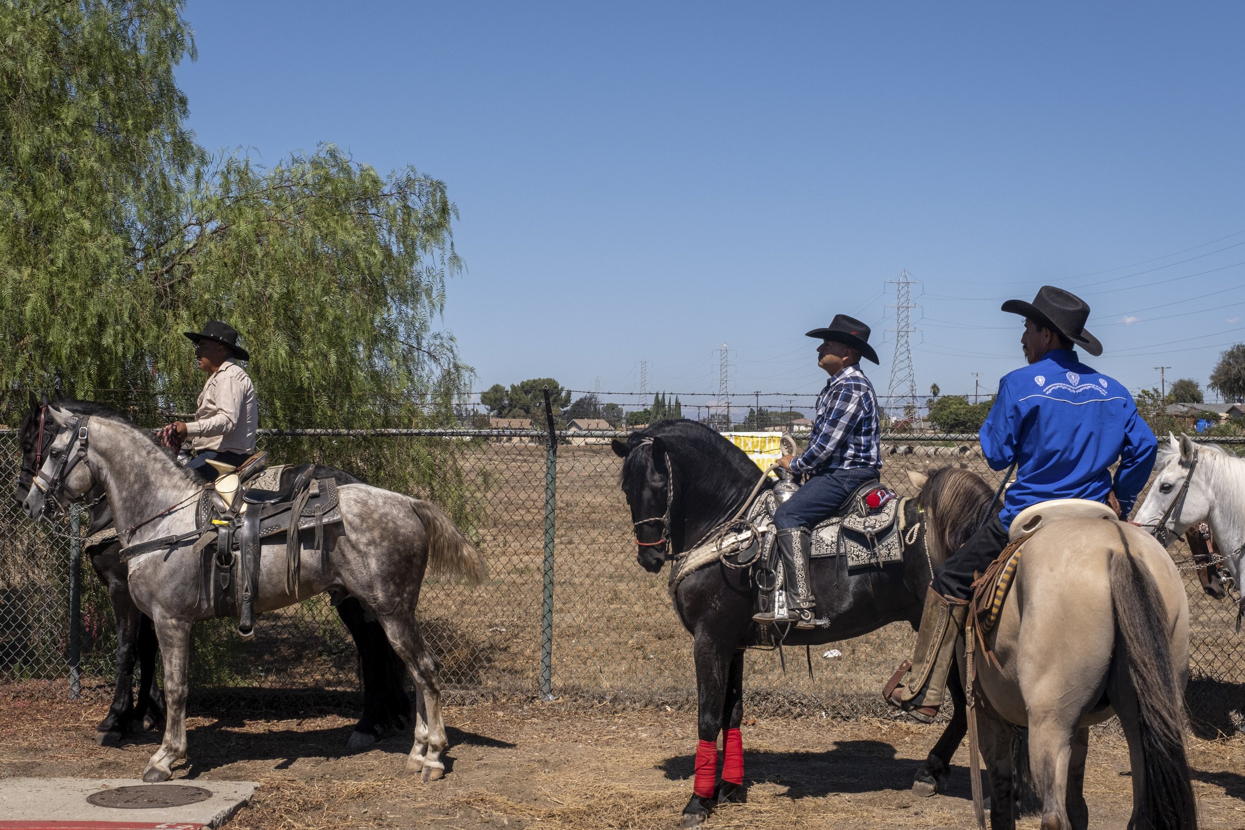  Riders rest on Alondra Blvd, as the large group stops in front of the vacant site. City of Compton, Calif. on Sunday, Sept 25. (Anna Sophia Moltke | The Corsair) 