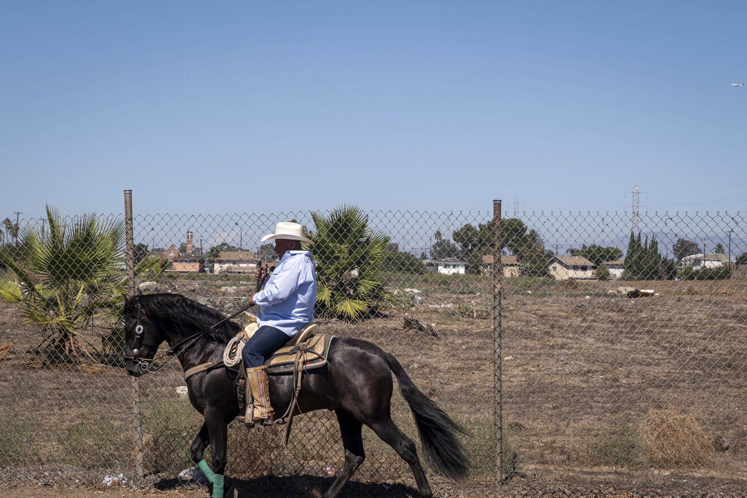  A lone rider canters past the empty land site in Compton, Calif., on Sunday, Sept 25. (Anna Sophia Moltke | The Corsair) 
