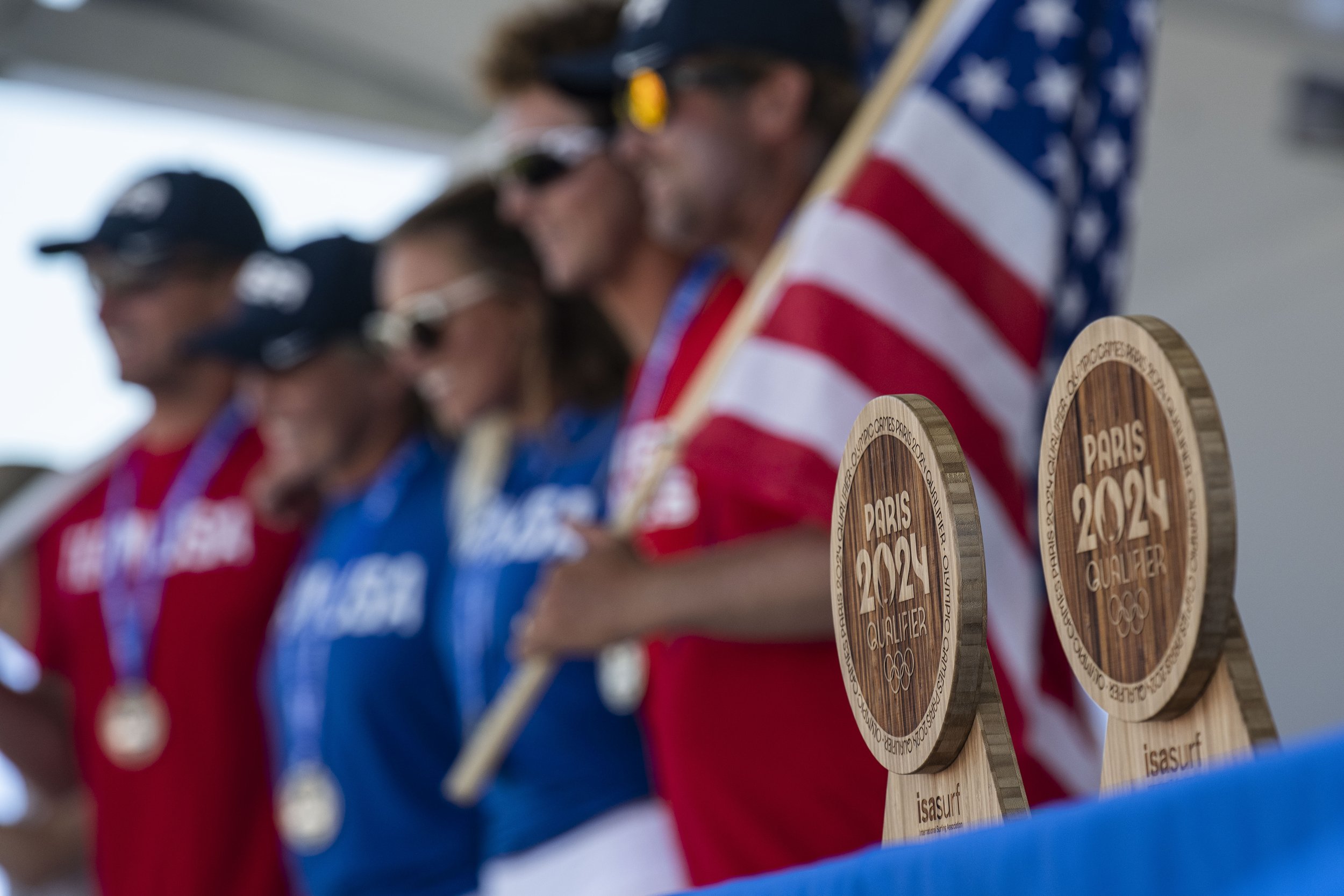  Team USA poses for a picture with the ISA surf trophys in frame. (Jon Putman | The Corsair) 