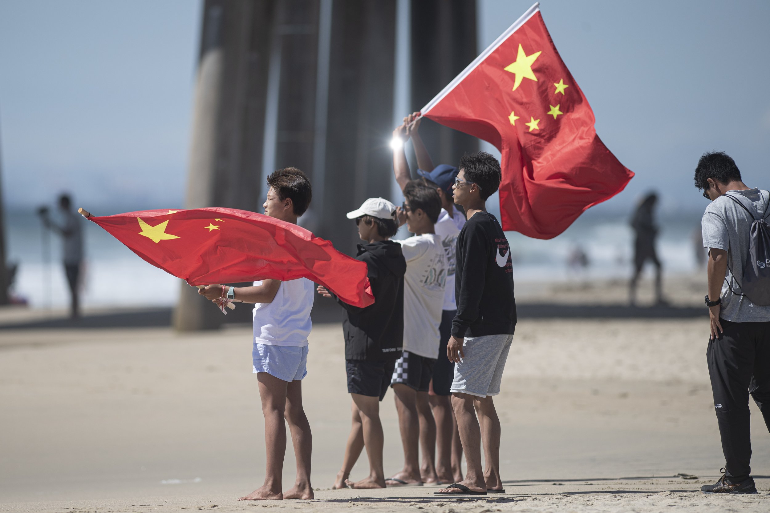  Members from team China cheer as their team members complete their heat. (Jon Putman | The Corsair) 