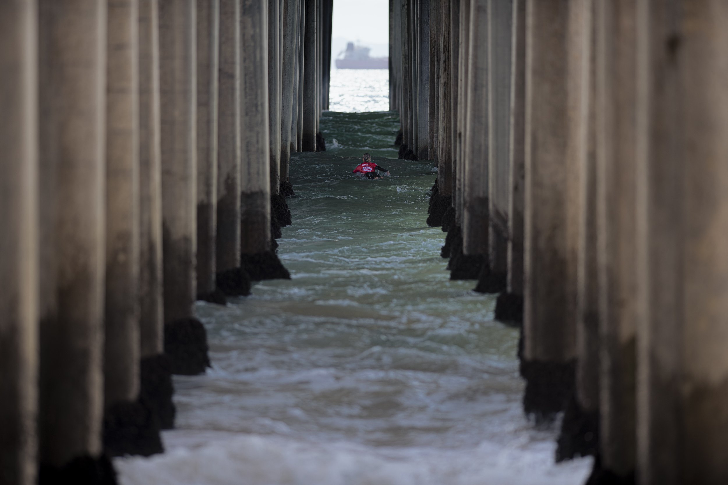  Yaomei Wo a surfer from China paddles out as she is called foer her first qualification attempt. (Jon Putman | The Corsair) 