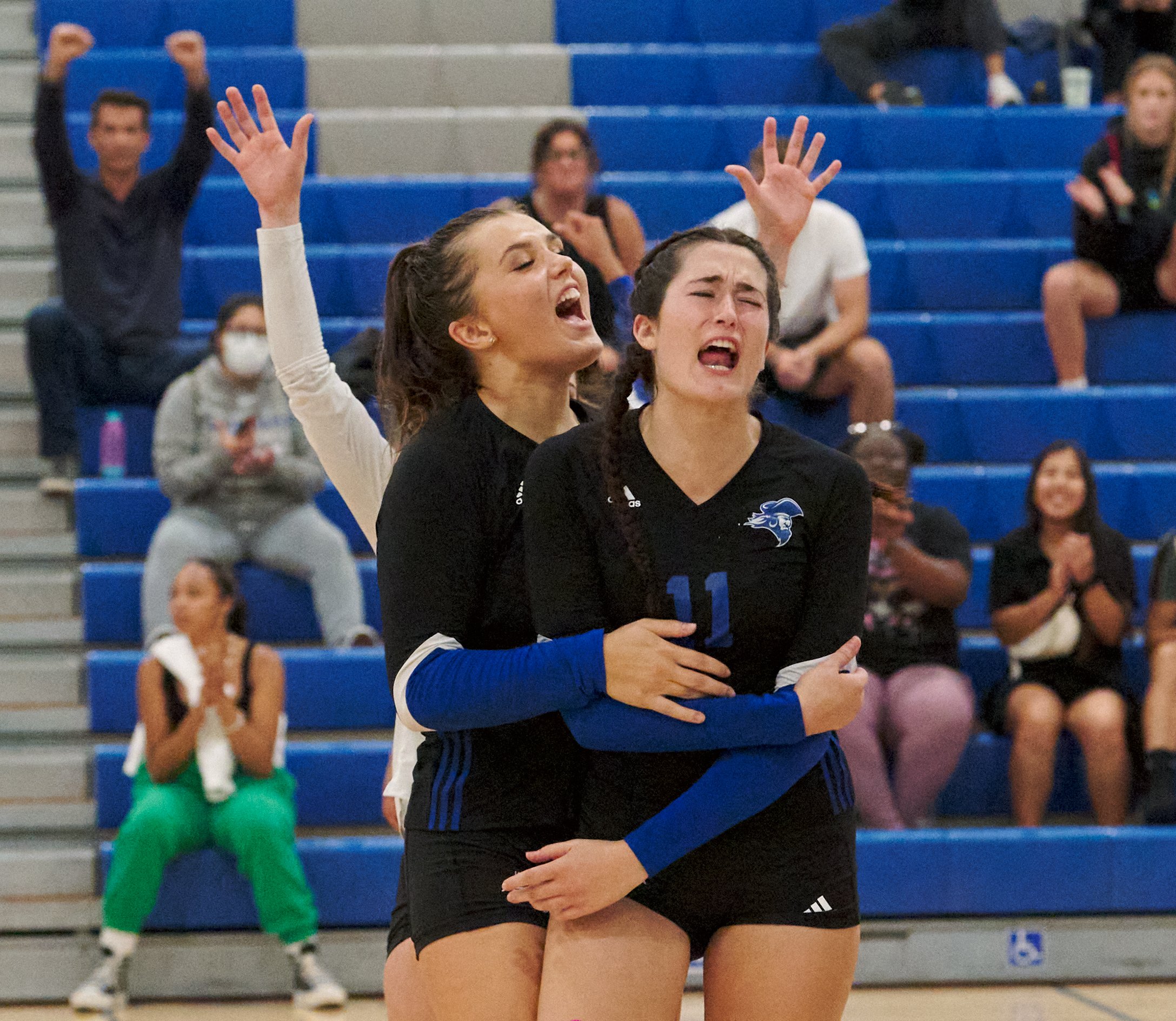  Santa Monica College Corsairs' Mackenzie Wolff and Maiella Riva, and Halle Anderson's jazz hands, after scoring a point during the women's volleyball match against the Moorpark College Raiders on Friday, Sept. 23, 2022, at the Corsair Gym in Santa M